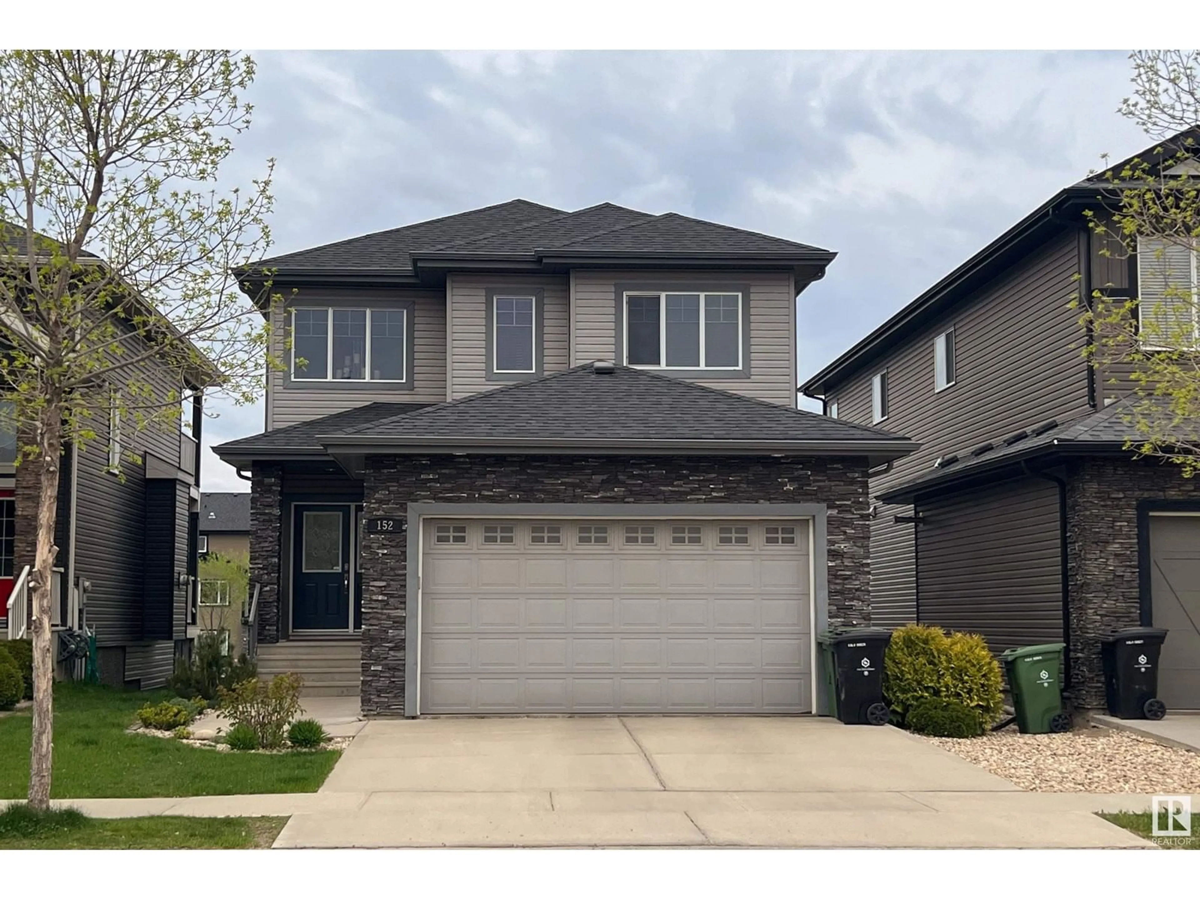 Home with vinyl exterior material, street for 152 DURRAND BN, Fort Saskatchewan Alberta T8L0M8