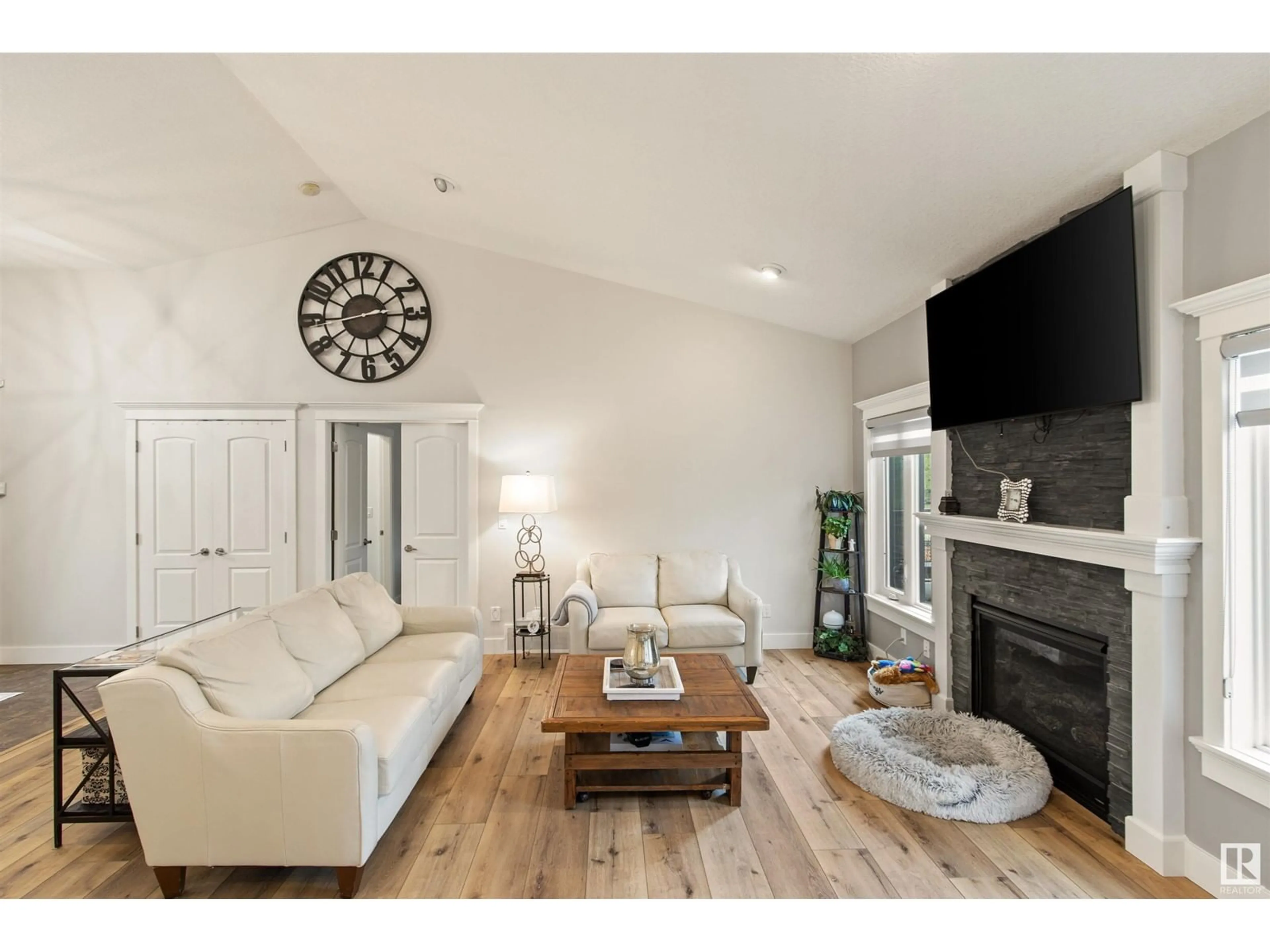 Living room with furniture, wood/laminate floor for 73 - 404 49119 RR, Rural Brazeau County Alberta T7A0B9