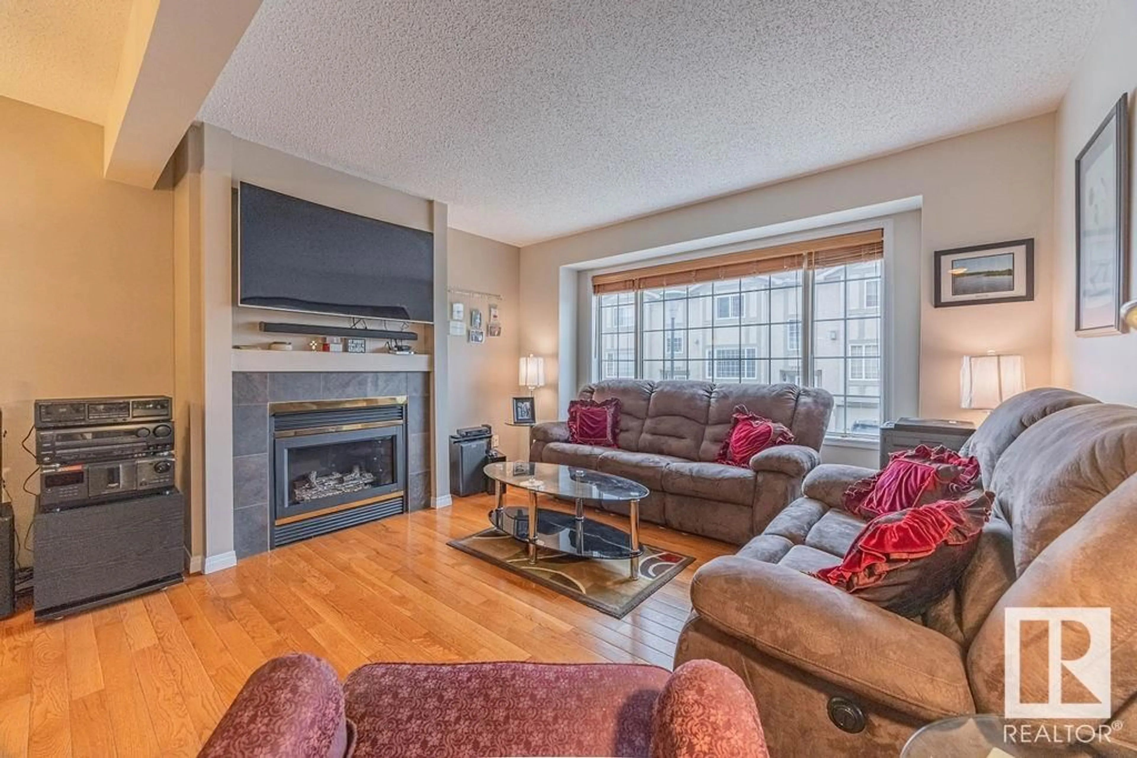 Living room with furniture, wood/laminate floor for 17616 96 AV, Edmonton Alberta T5T6C2