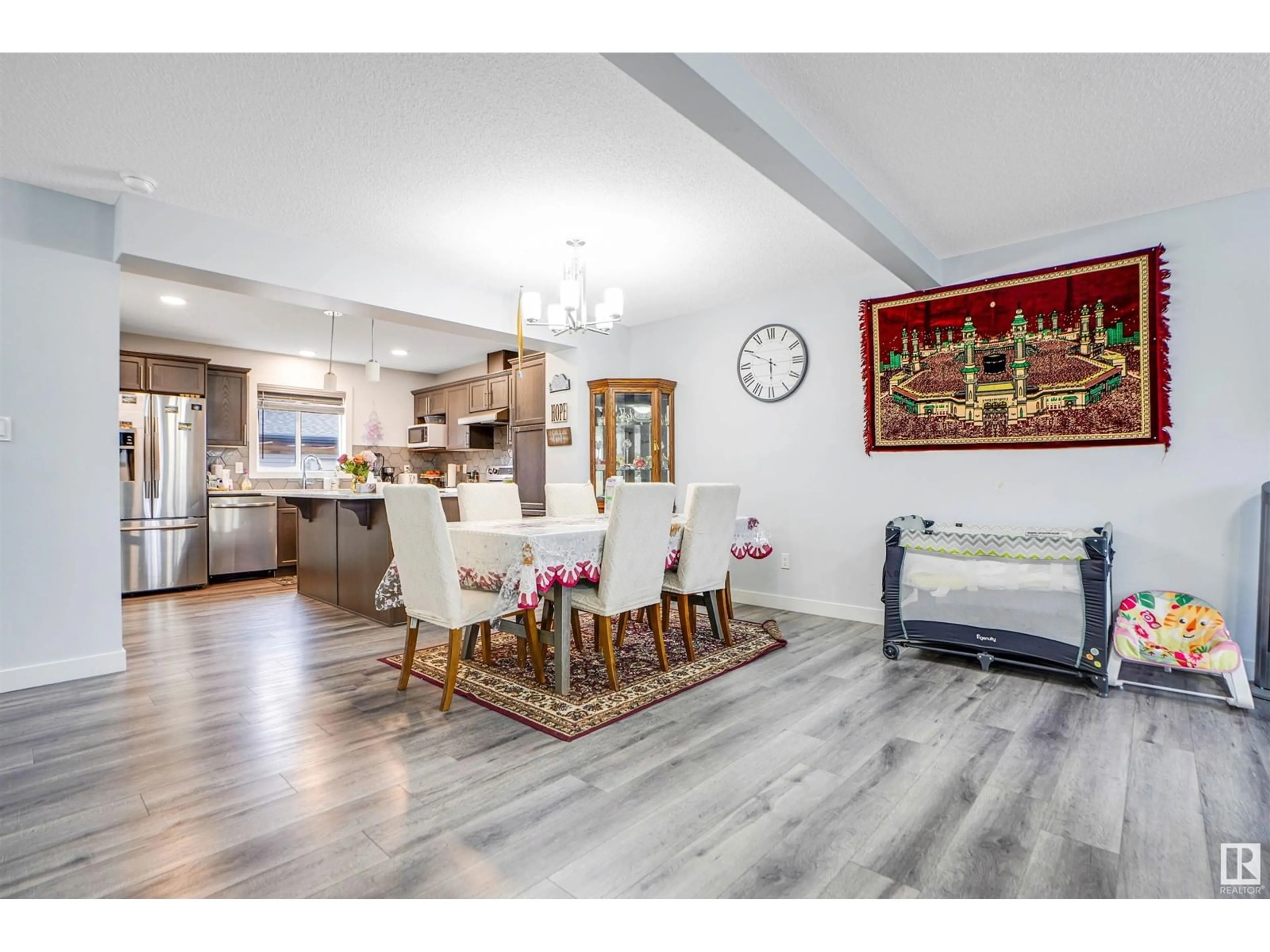 Open concept kitchen, wood/laminate floor for 2611 14 AV, Edmonton Alberta T6T2J2