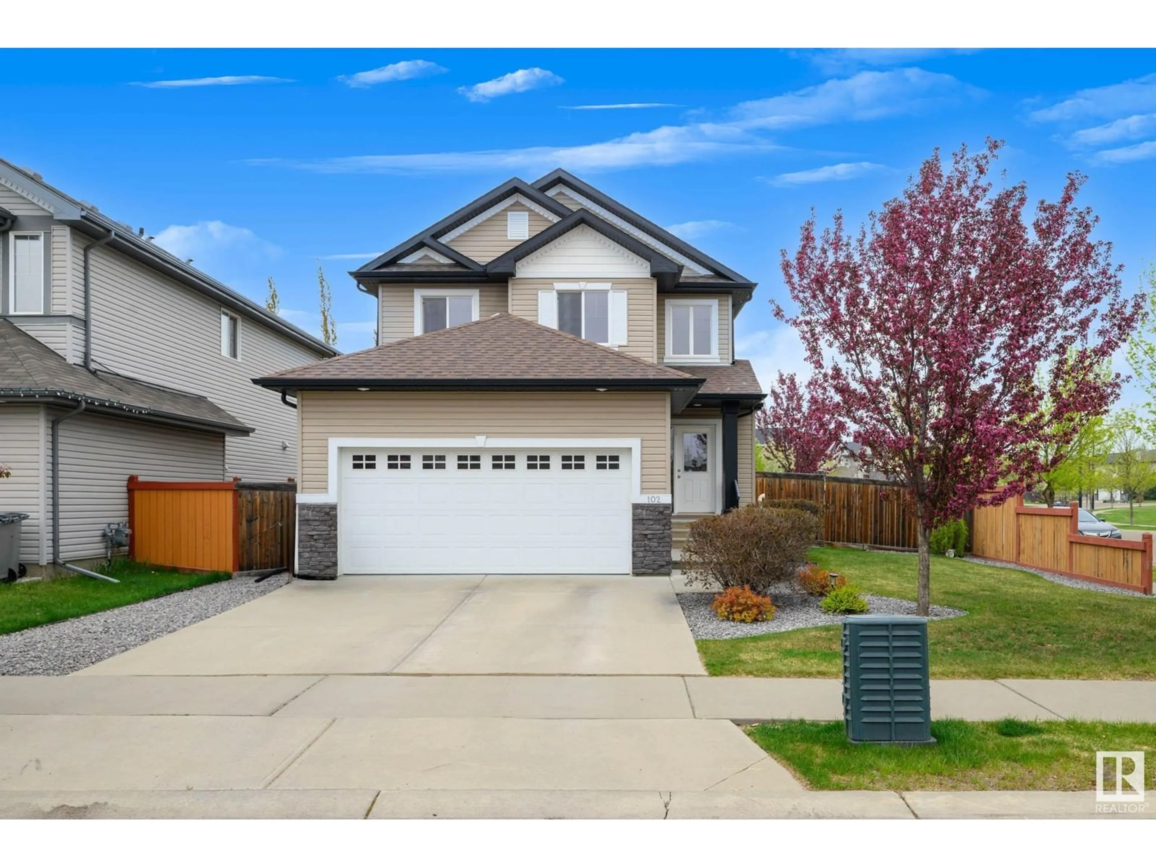 Home with vinyl exterior material, street for 102 POINTE MARSAN, Beaumont Alberta T4X0A2