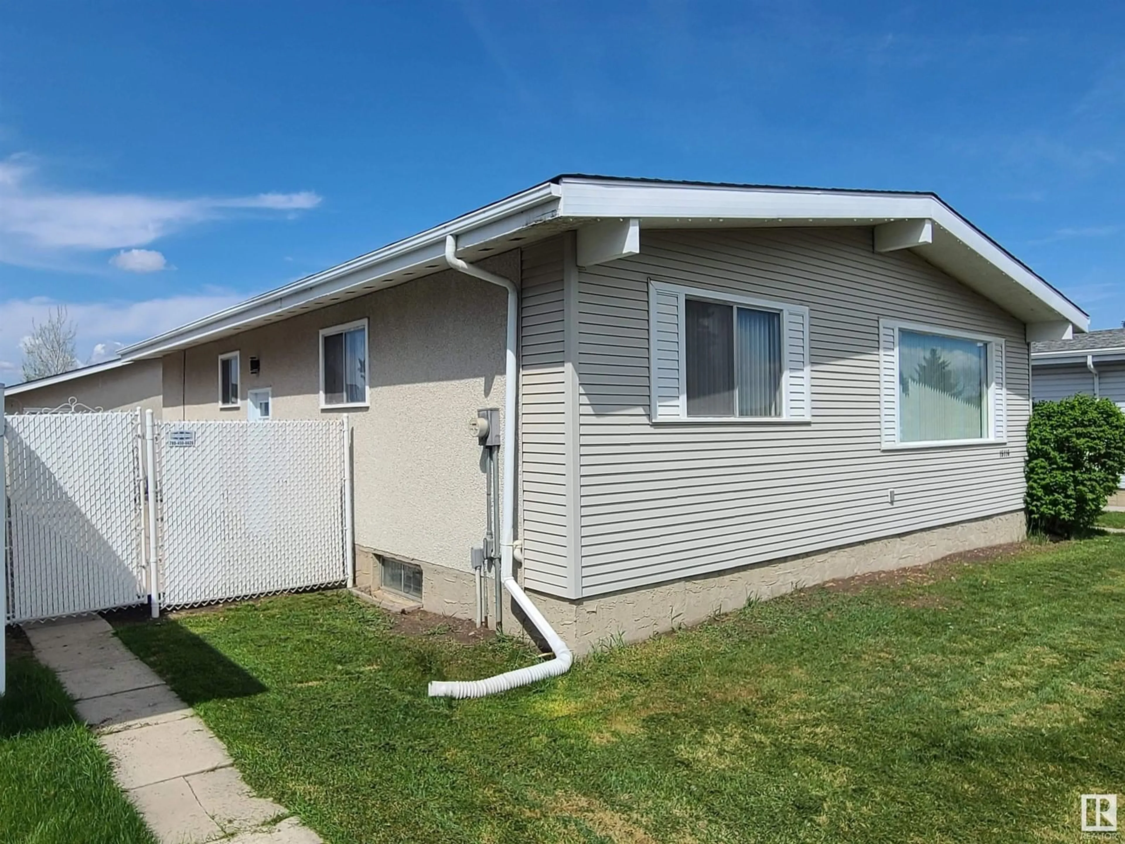Home with vinyl exterior material, street for 15116 75A ST NW, Edmonton Alberta T5C1A7
