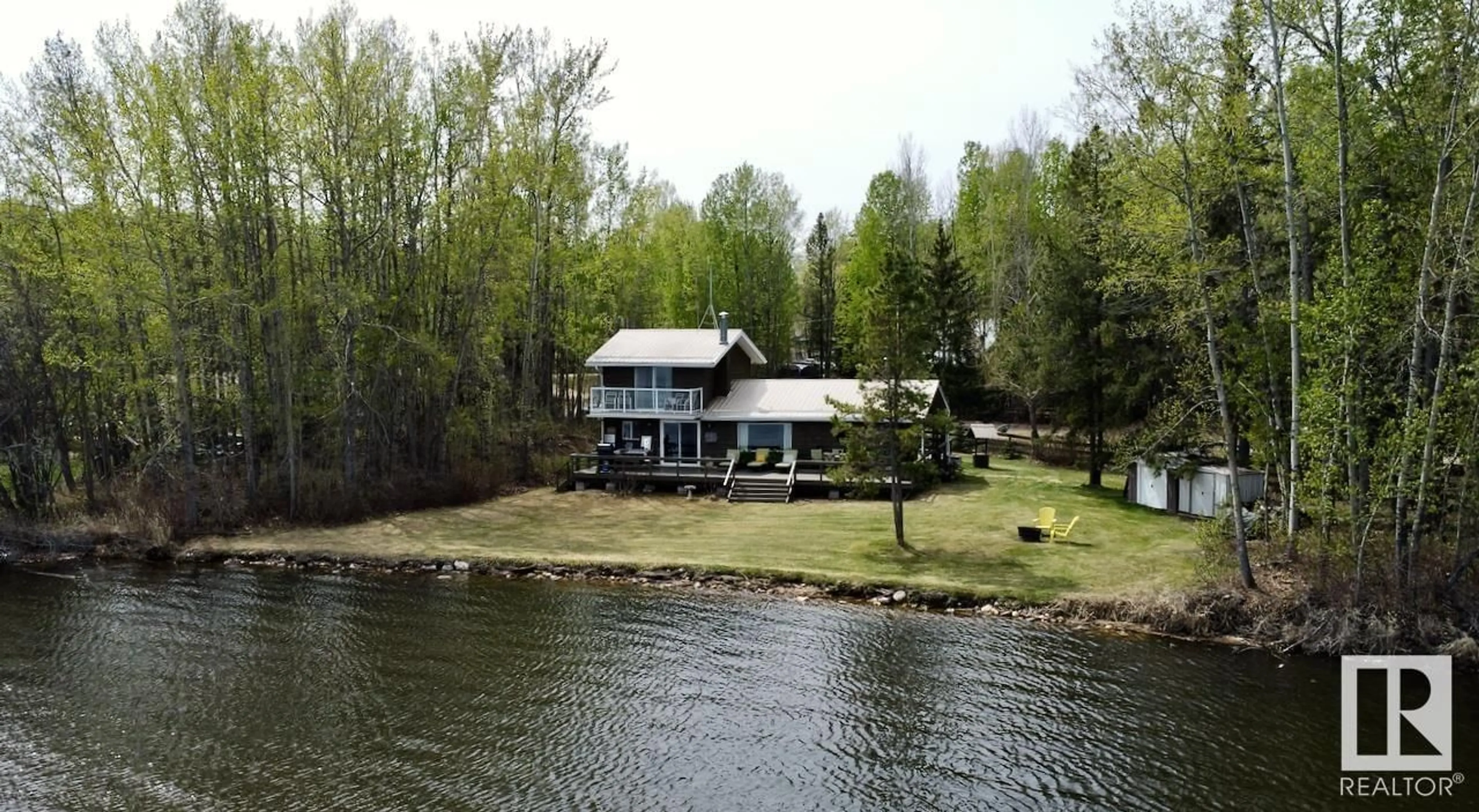 A pic from outside/outdoor area/front of a property/back of a property/a pic from drone, water/lake/river/ocean view for 150 LAKE AV, Rural Parkland County Alberta T0E0W0