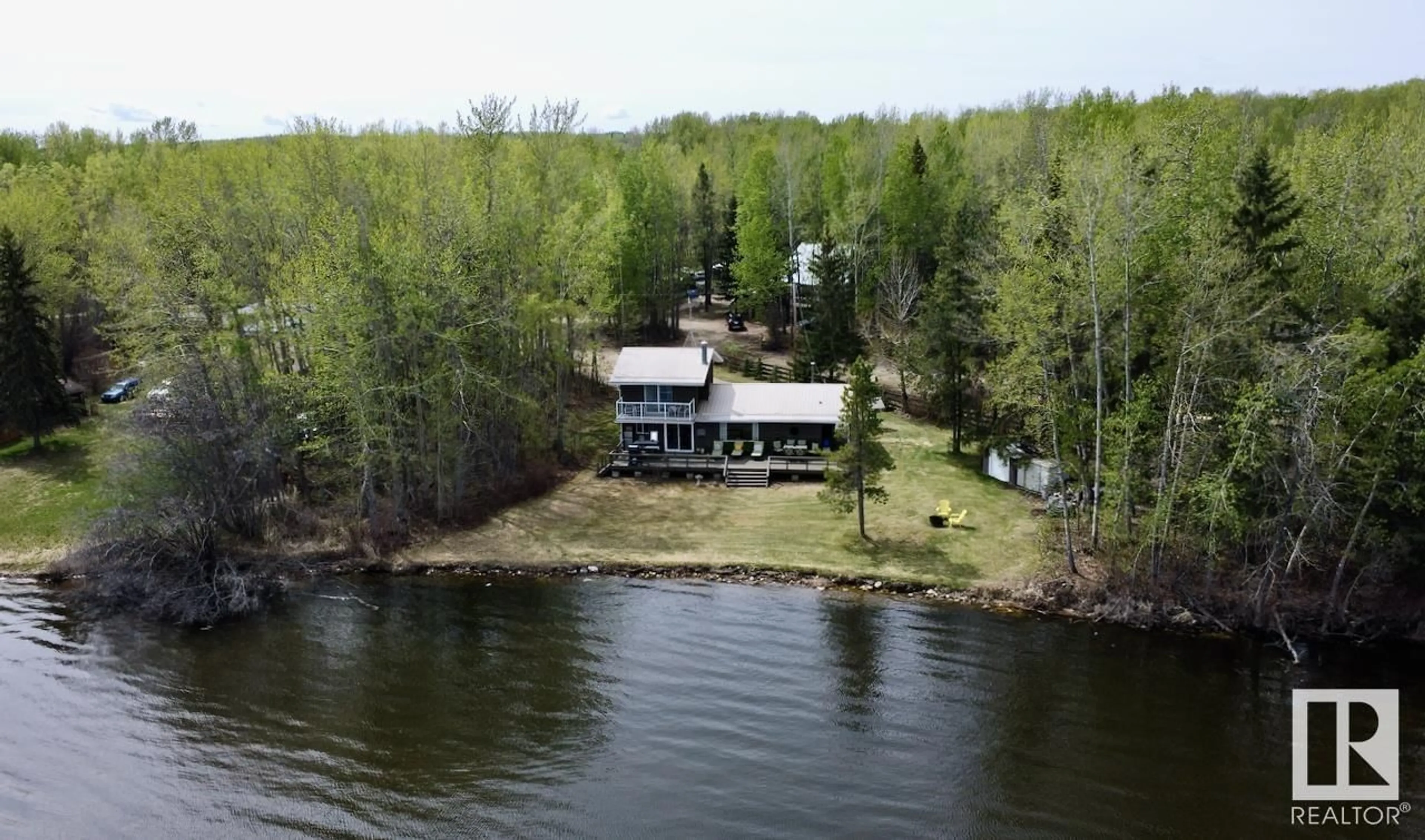 A pic from outside/outdoor area/front of a property/back of a property/a pic from drone, water/lake/river/ocean view for 150 LAKE AV, Rural Parkland County Alberta T0E0W0