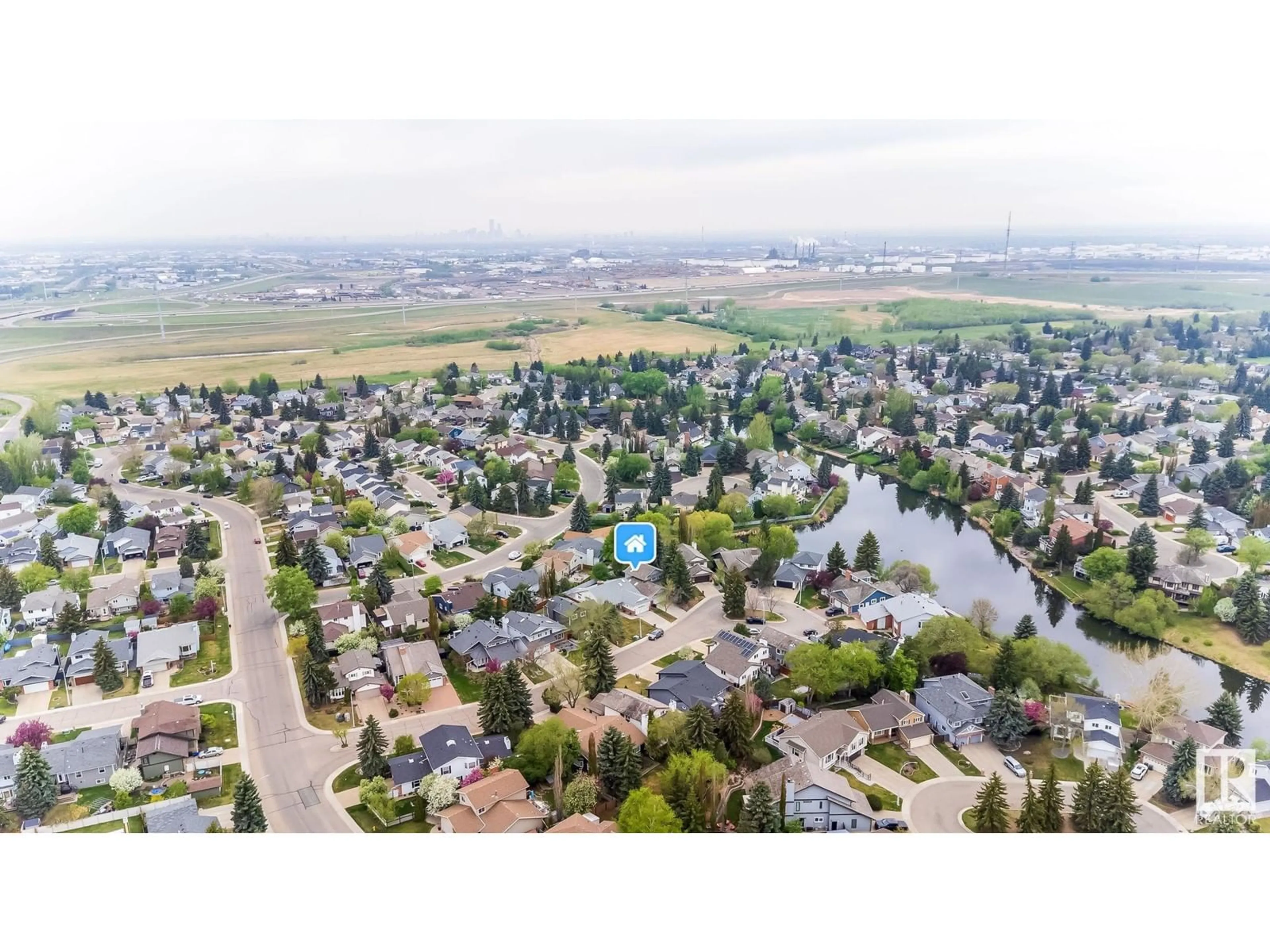 A pic from outside/outdoor area/front of a property/back of a property/a pic from drone, water/lake/river/ocean view for 182 VILLAGE ESTATE, Sherwood Park Alberta T8A4P5