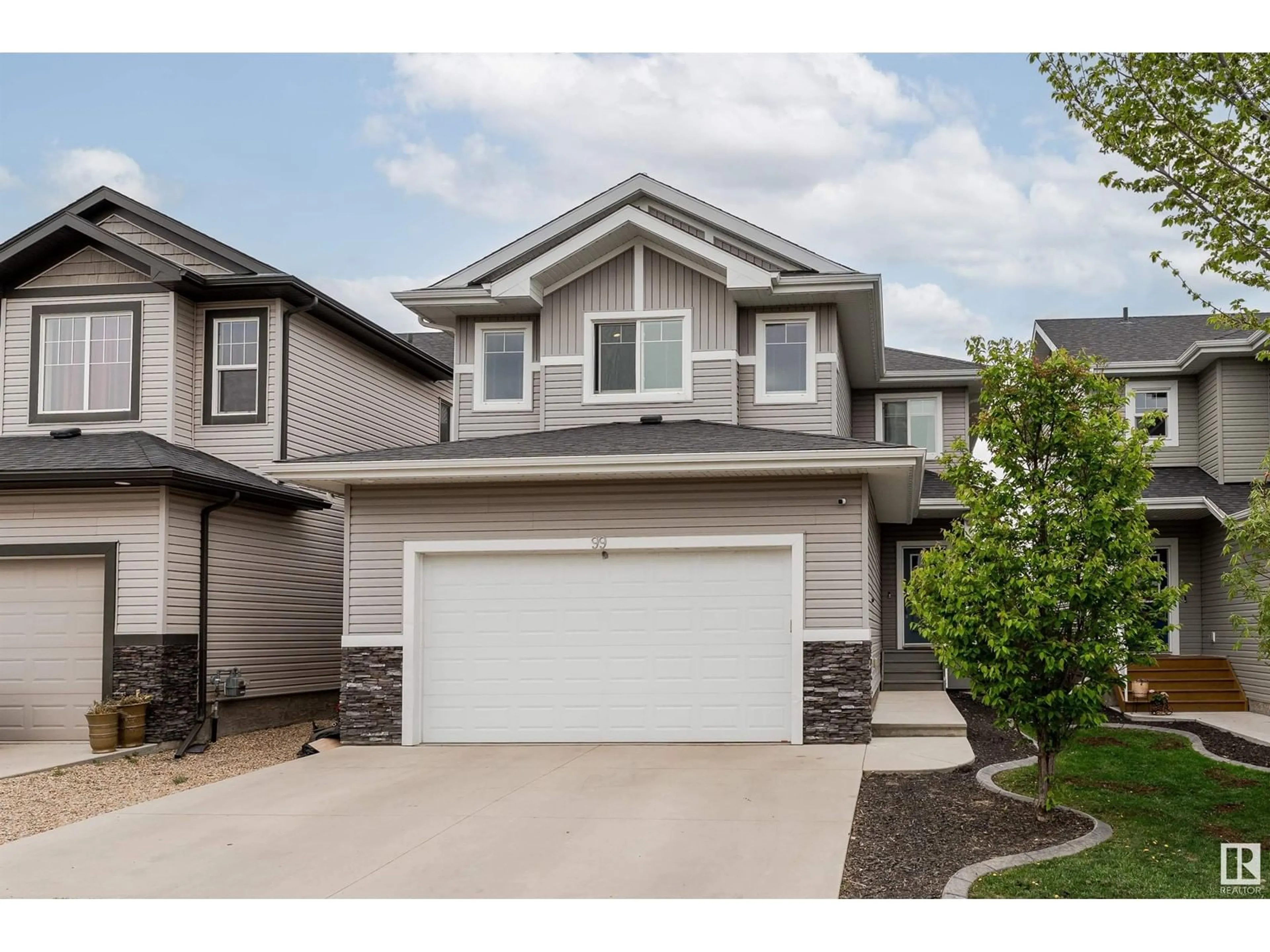 Home with vinyl exterior material, street for 99 RIDGELAND, Fort Saskatchewan Alberta T8L0P5