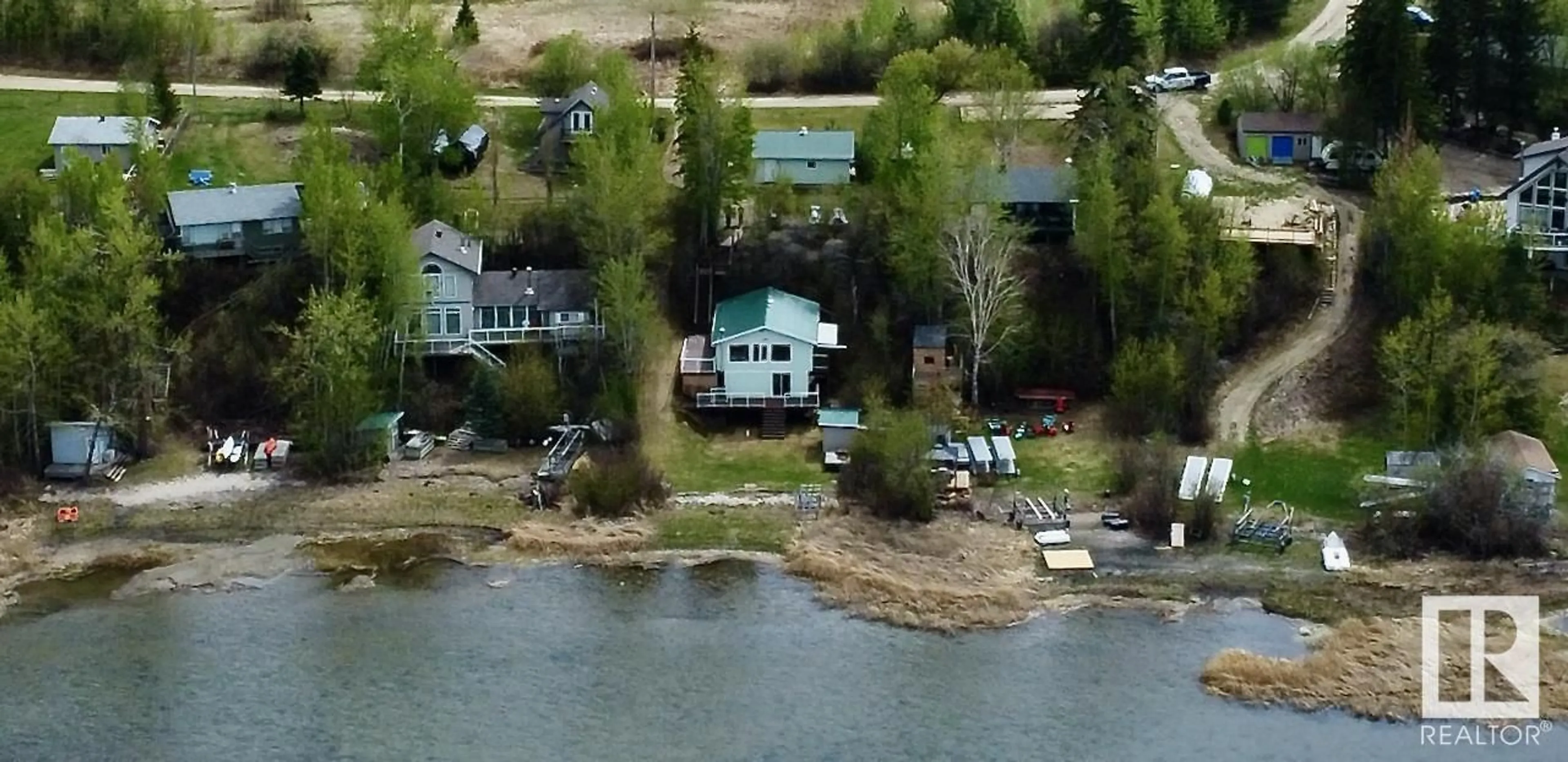 A pic from outside/outdoor area/front of a property/back of a property/a pic from drone, water/lake/river/ocean view for #14 - 52515 RGE ROAD 52, Rural Parkland County Alberta T0E2B0
