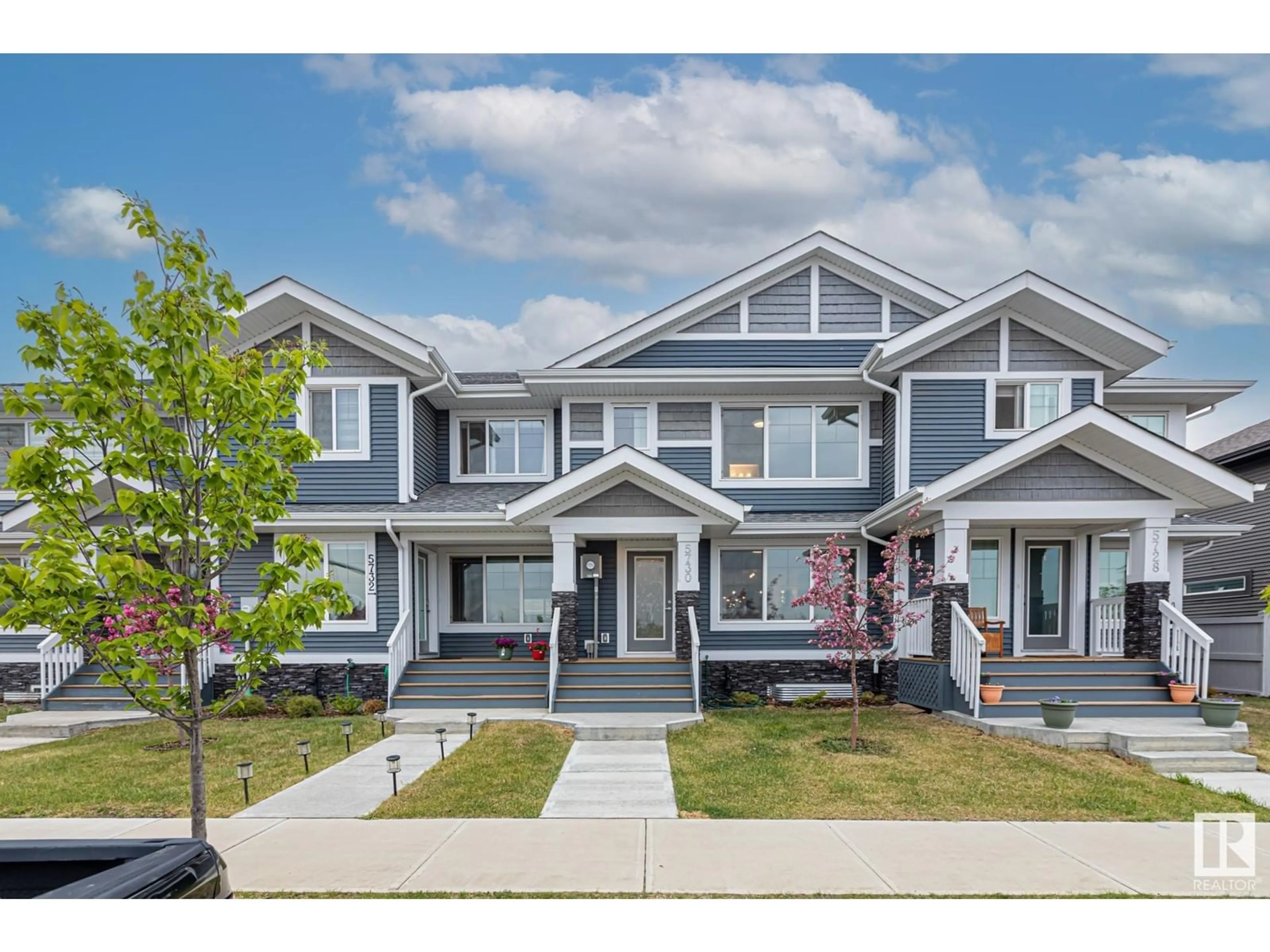 Home with vinyl exterior material, street for NW - 5730 JUCHLI AV, Edmonton Alberta T5E6Y2