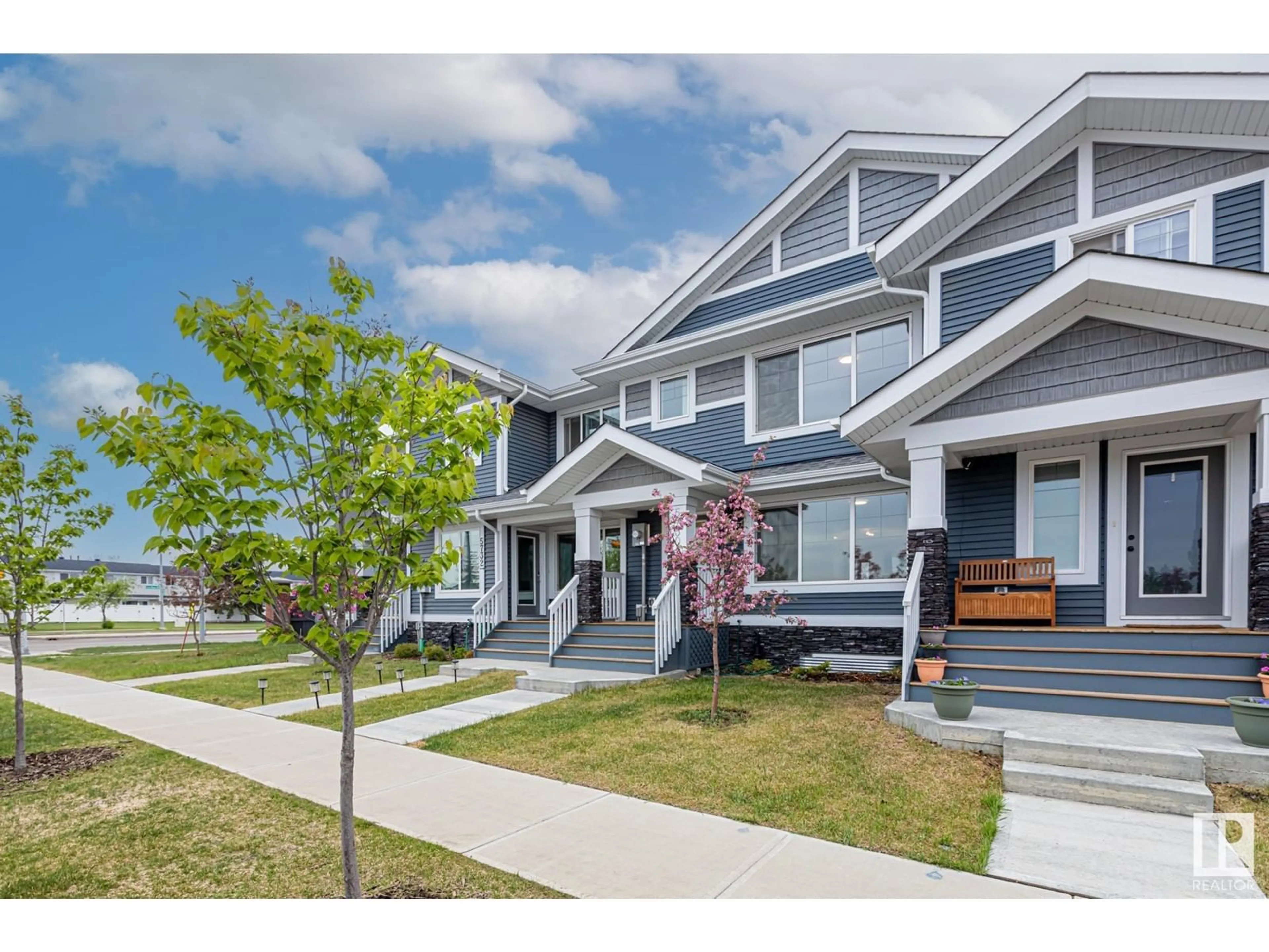 Home with vinyl exterior material, street for NW - 5730 JUCHLI AV, Edmonton Alberta T5E6Y2