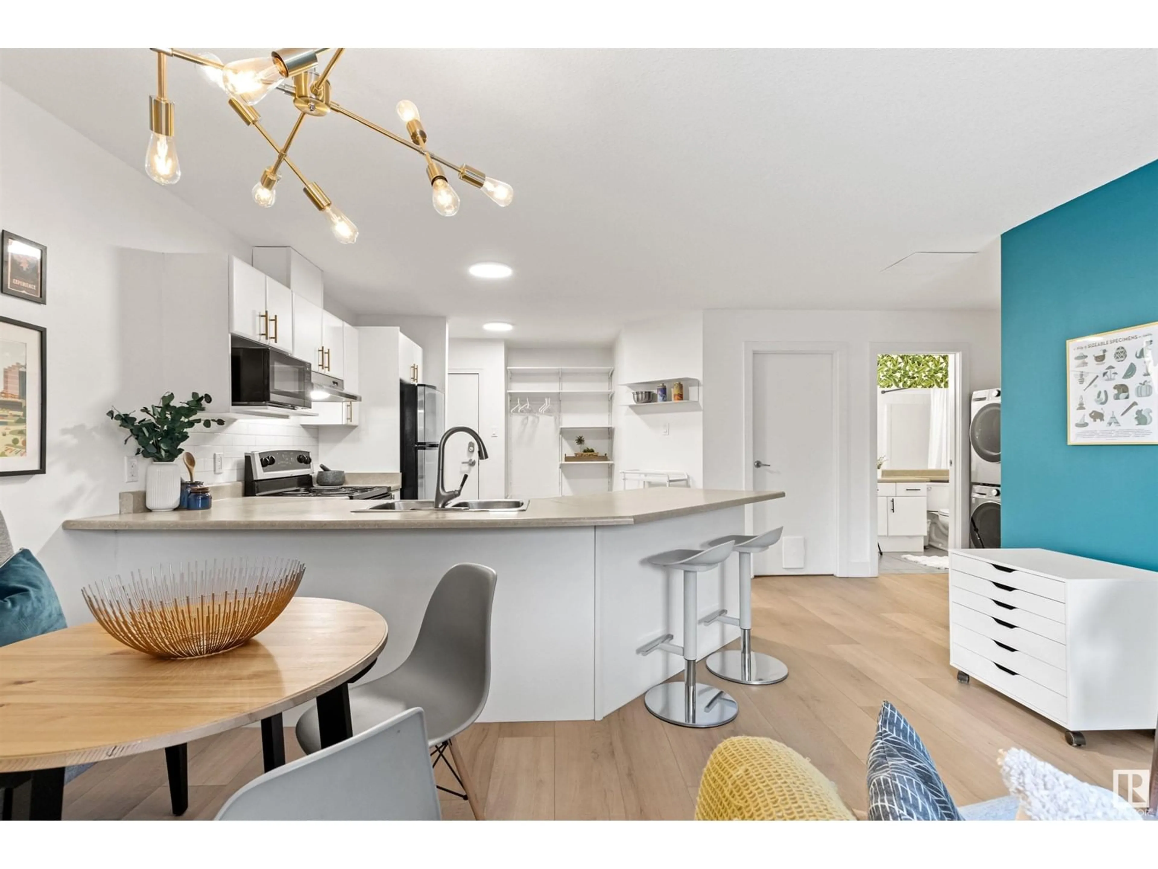 Open concept kitchen, wood/laminate floor for #104 - 9715 110 ST NW, Edmonton Alberta T5K2M1