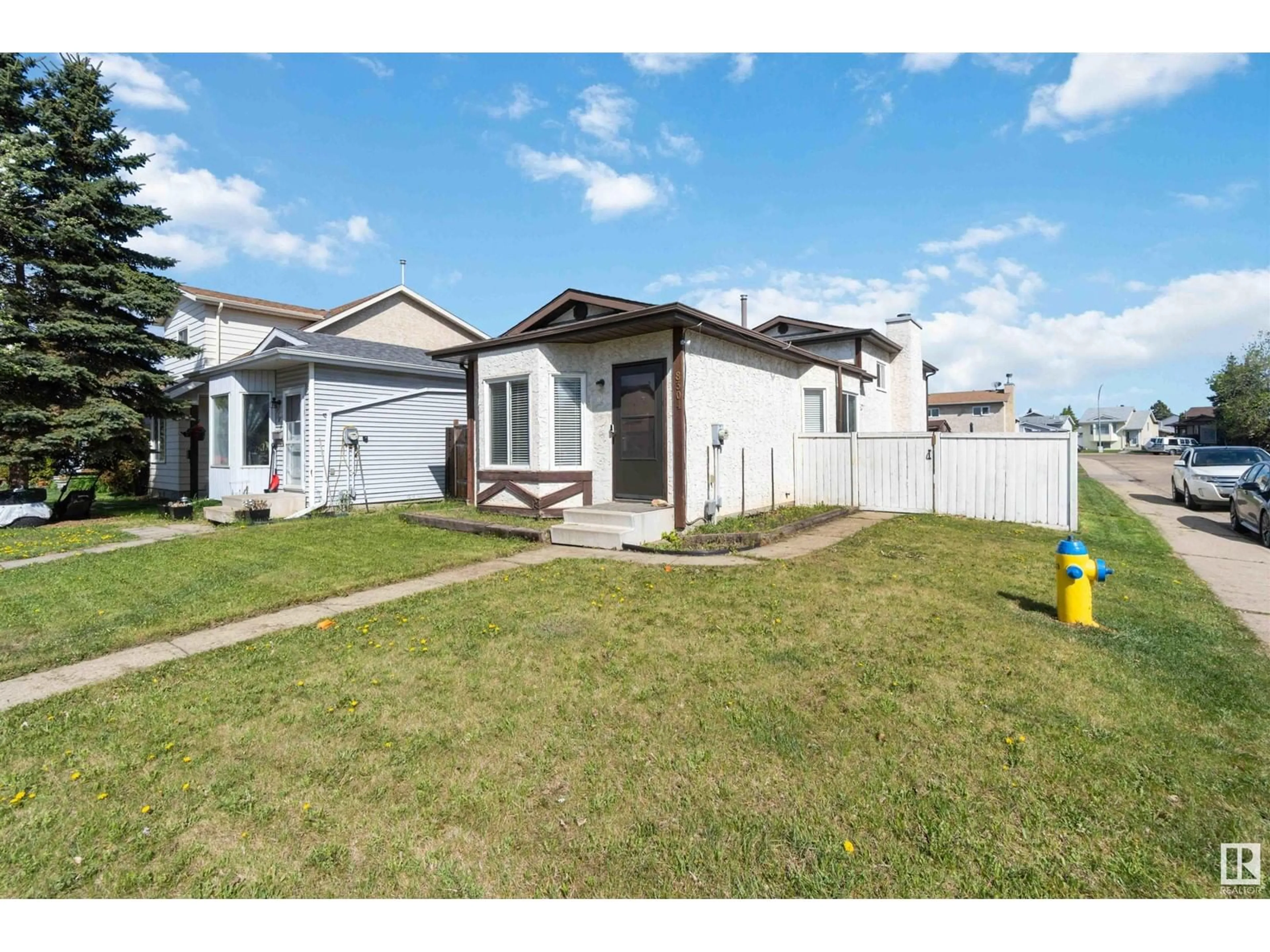 Home with vinyl exterior material, street for 8304 157 AV, Edmonton Alberta T5Z2P8
