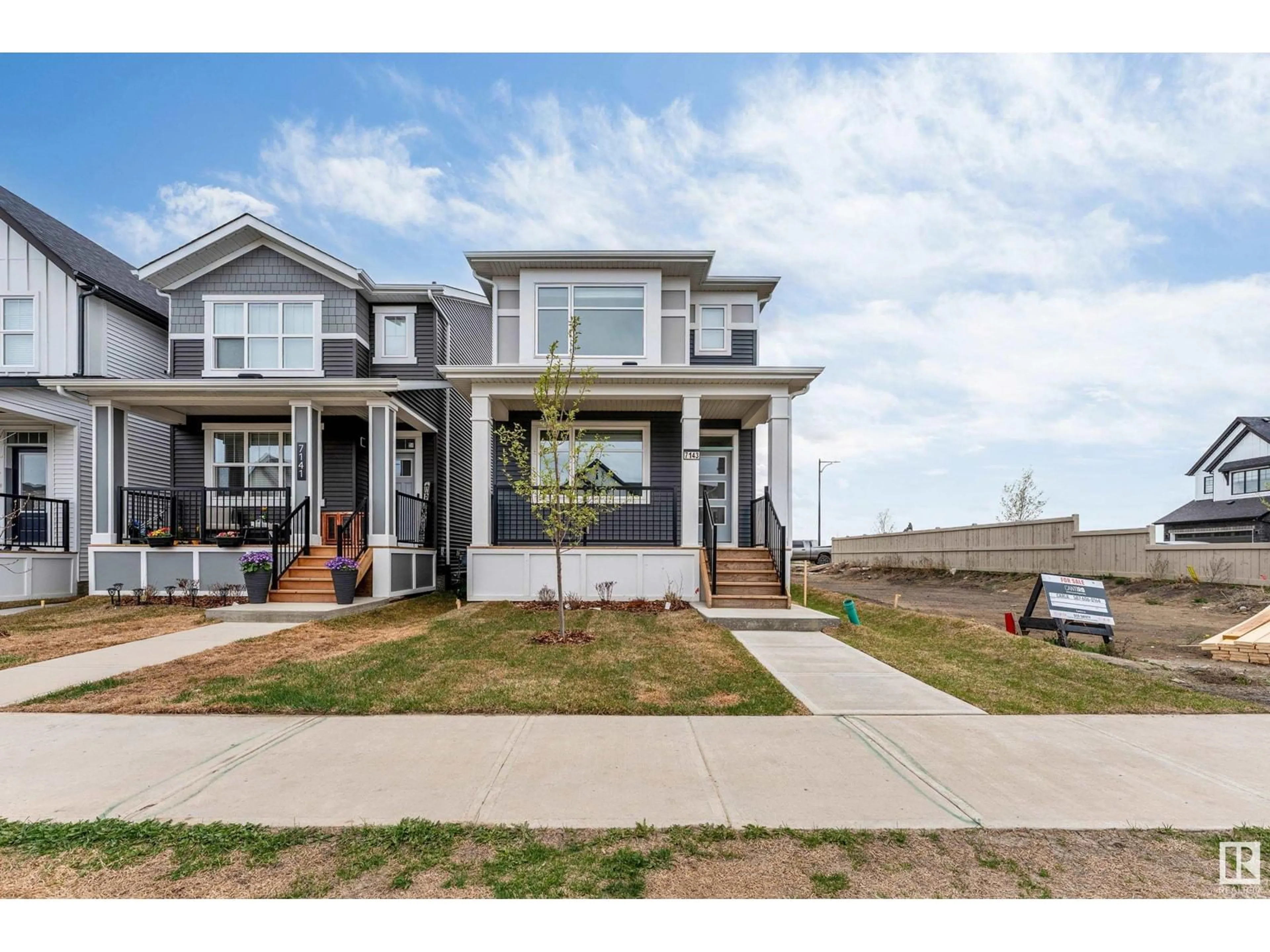 Home with vinyl exterior material, street for 7143 52 AV, Beaumont Alberta T4X2Z7
