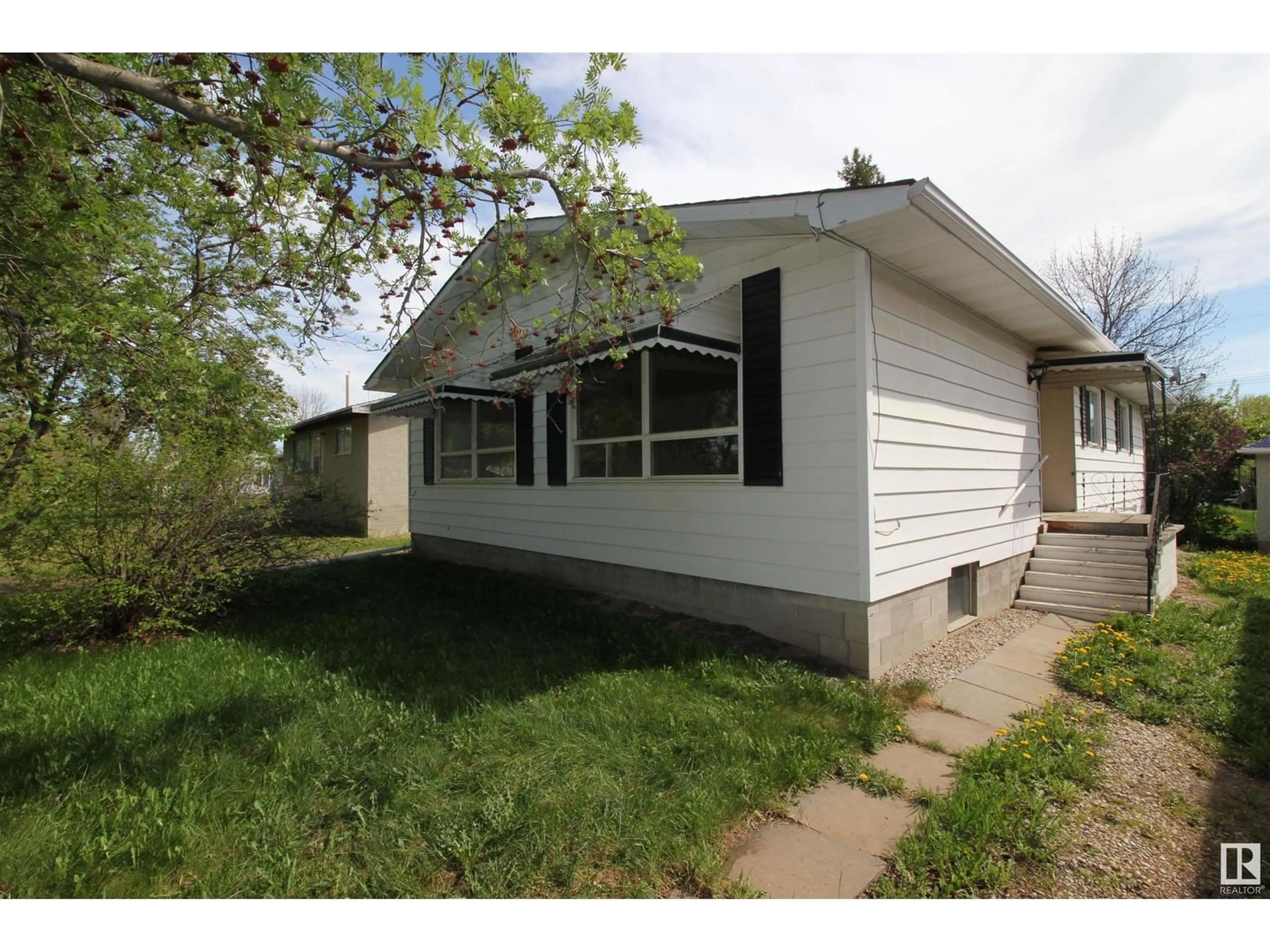 Home with vinyl exterior material, street for 5027 49 ST, Warburg Alberta T0C2T0