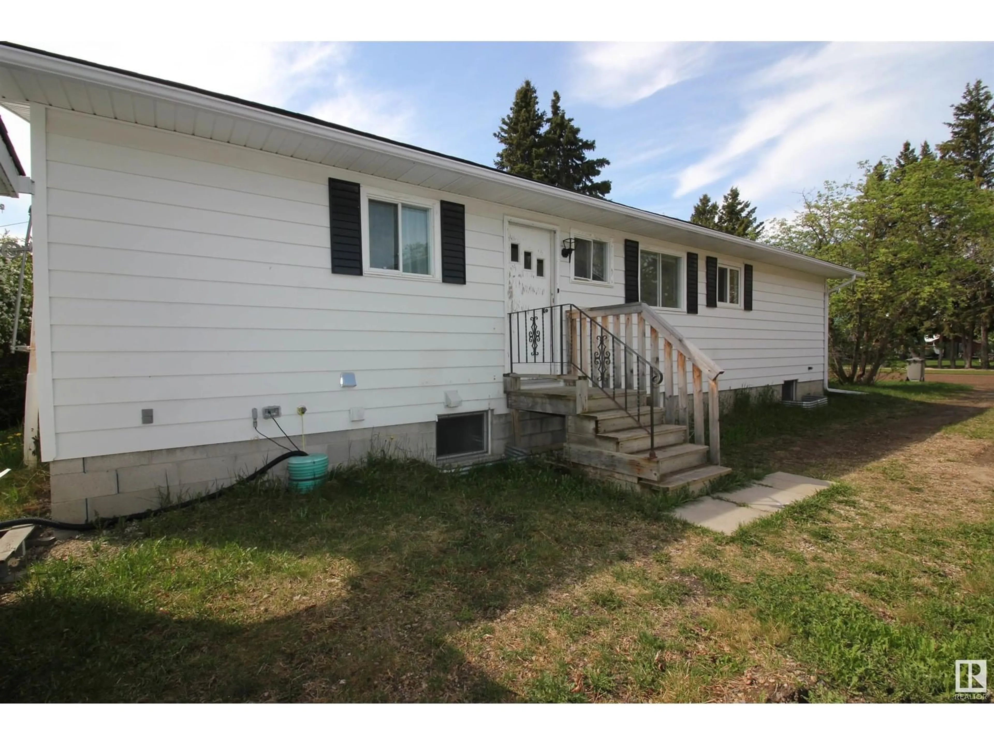 Home with vinyl exterior material, street for 5027 49 ST, Warburg Alberta T0C2T0
