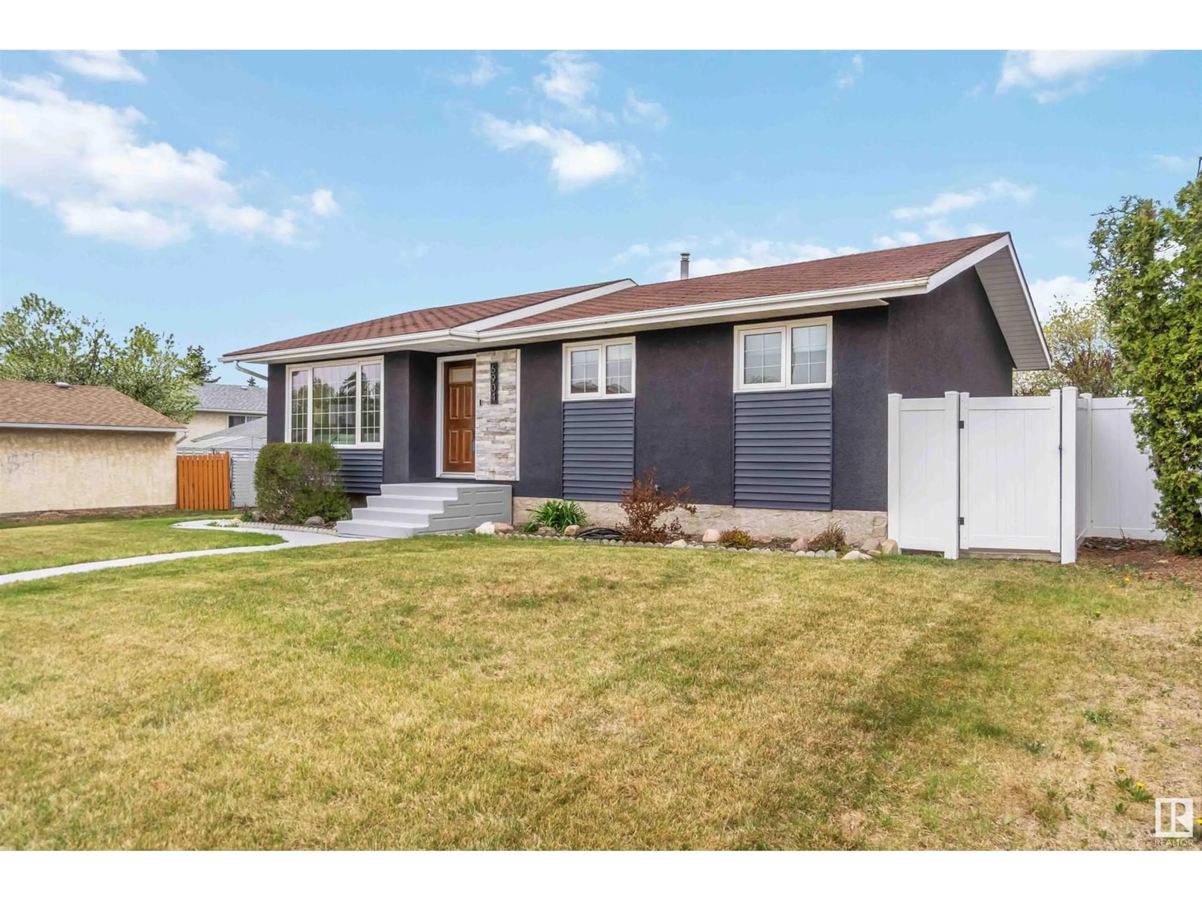 Home with vinyl exterior material, street for 6904 39 AV, Edmonton Alberta T6K1T8