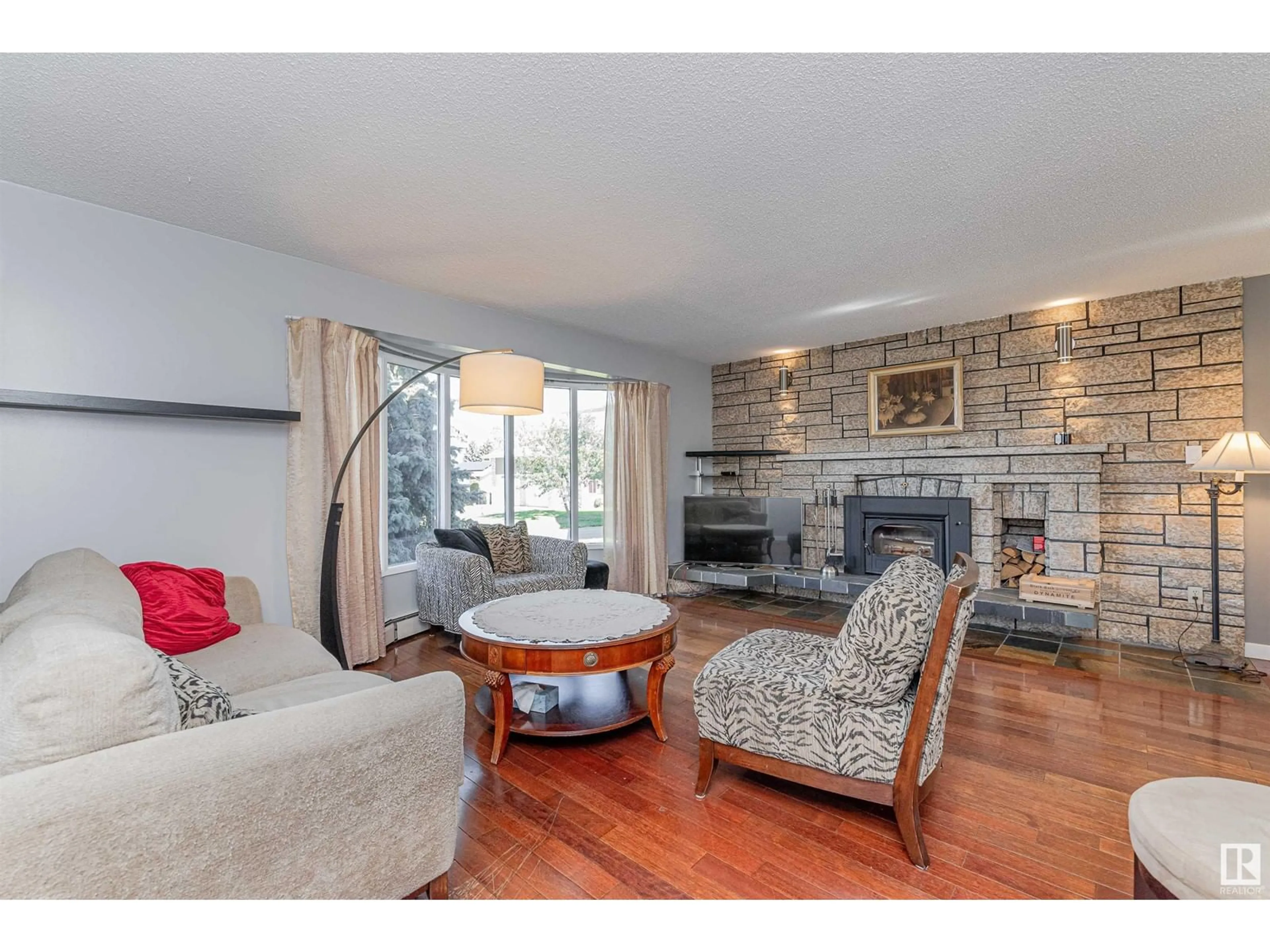 Living room with furniture, wood/laminate floor for 891 LEE RIDGE RD, Edmonton Alberta T6K0R1