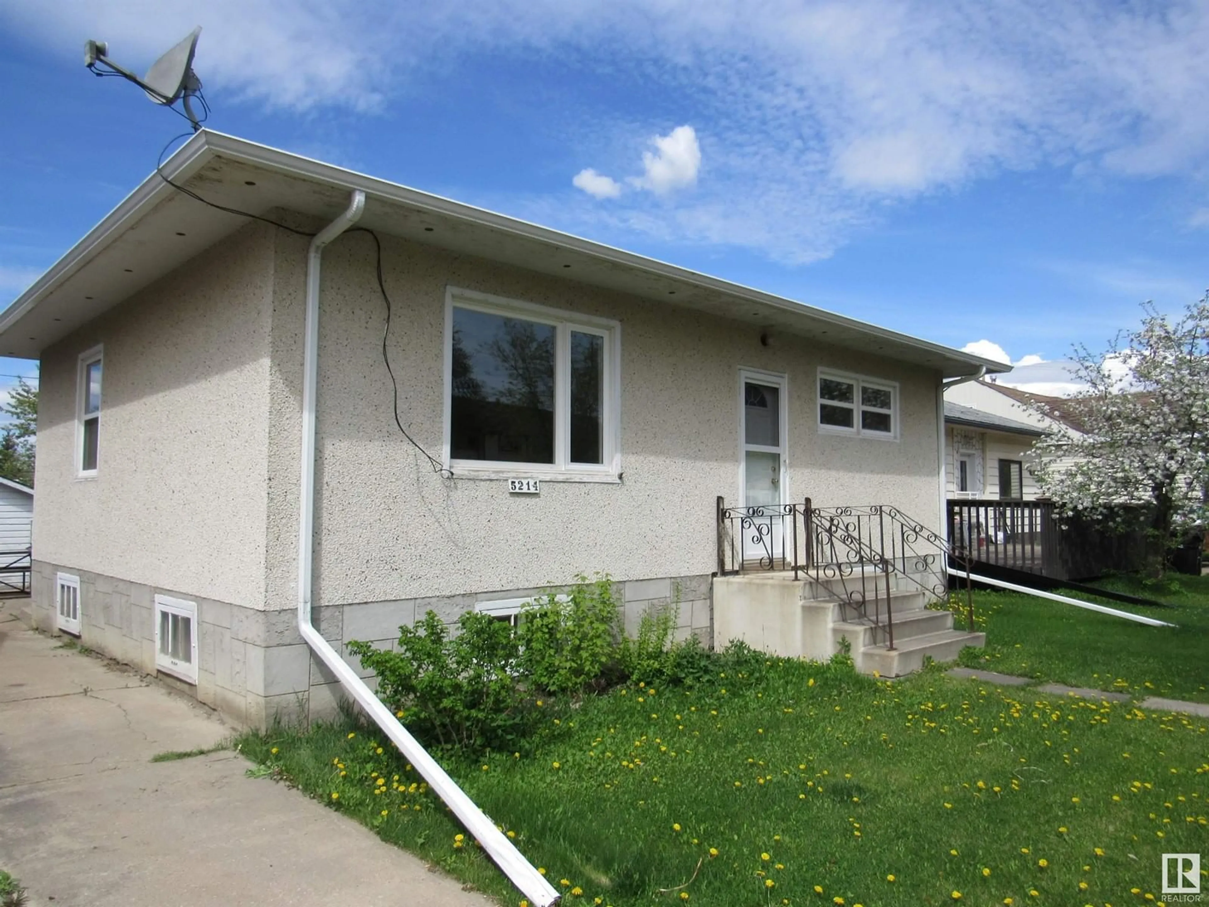 Home with vinyl exterior material, street for 5214 47 STREET, Barrhead Alberta T7N1N3