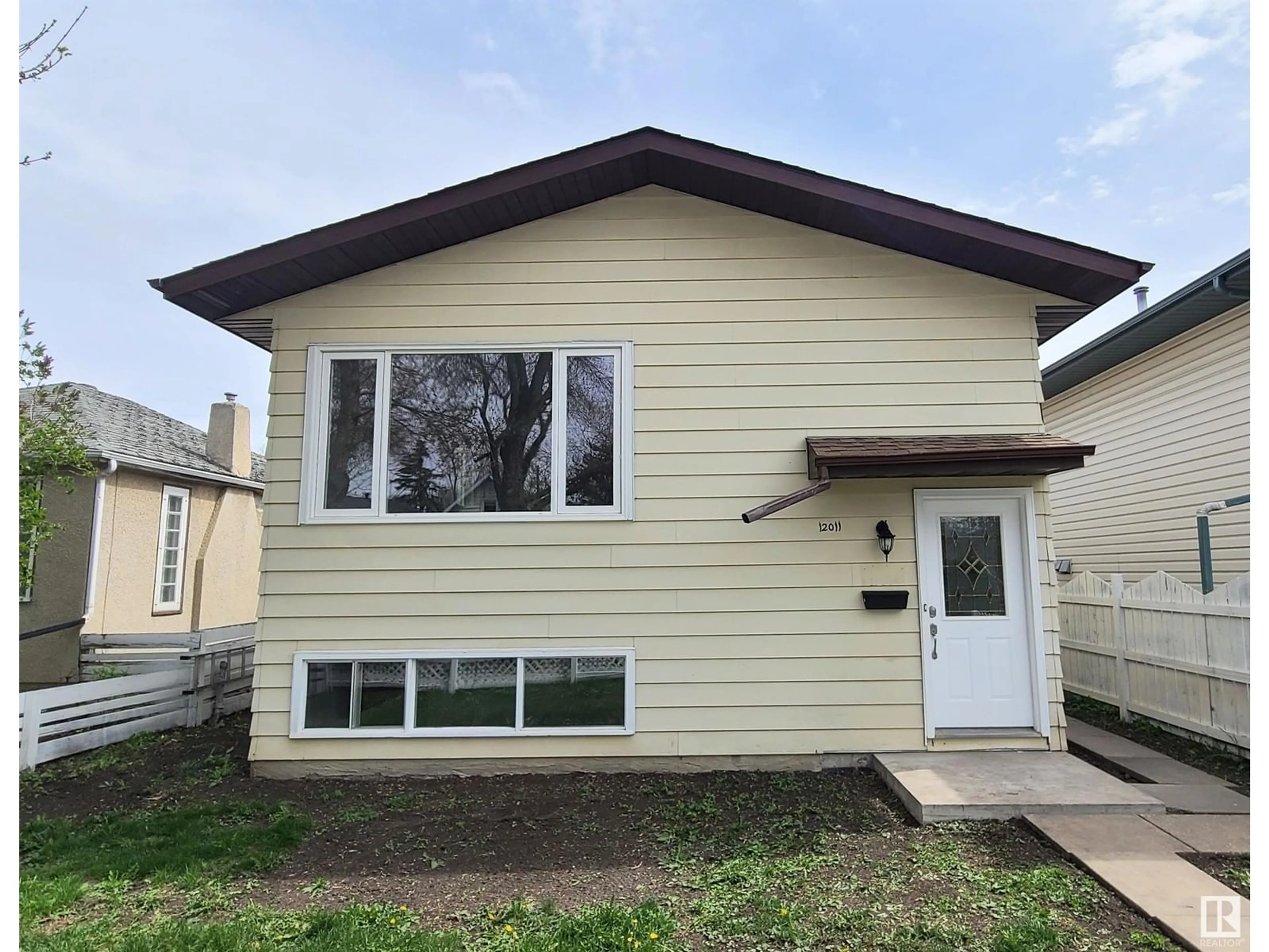 Home with vinyl exterior material, street for NW - 12011 95A ST, Edmonton Alberta T5G1R6