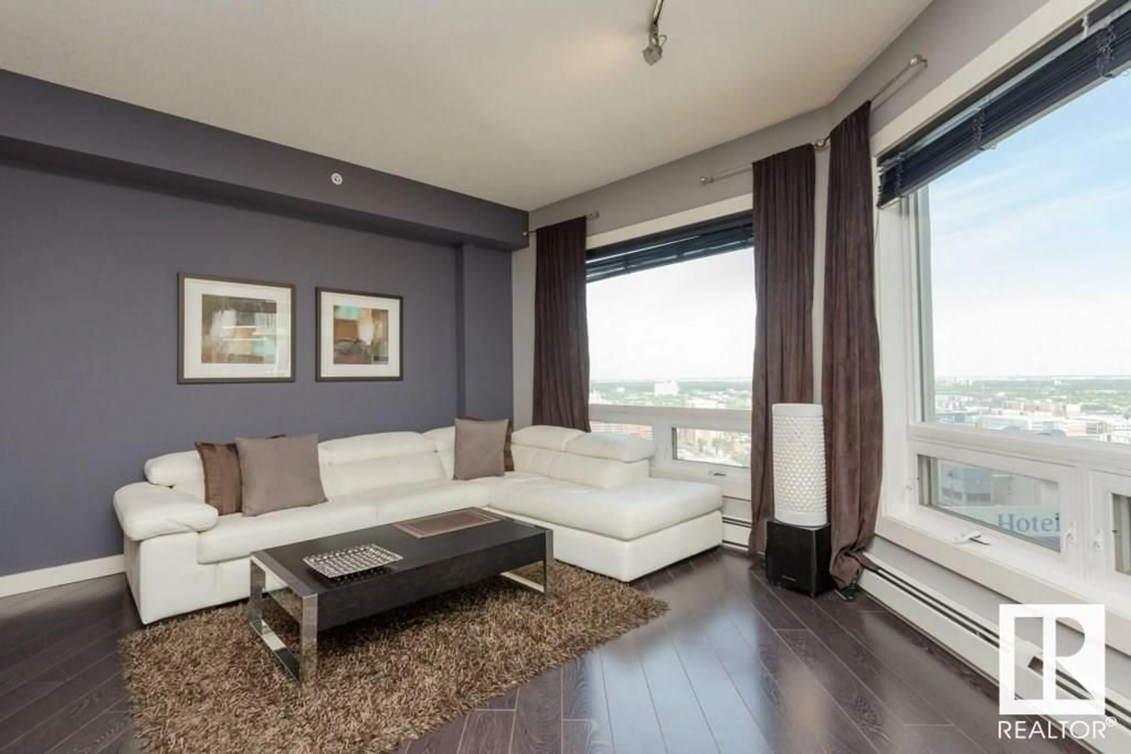 Living room with furniture, wood/laminate floor for 10136 - 2401 104 ST NW, Edmonton Alberta T5J0B5