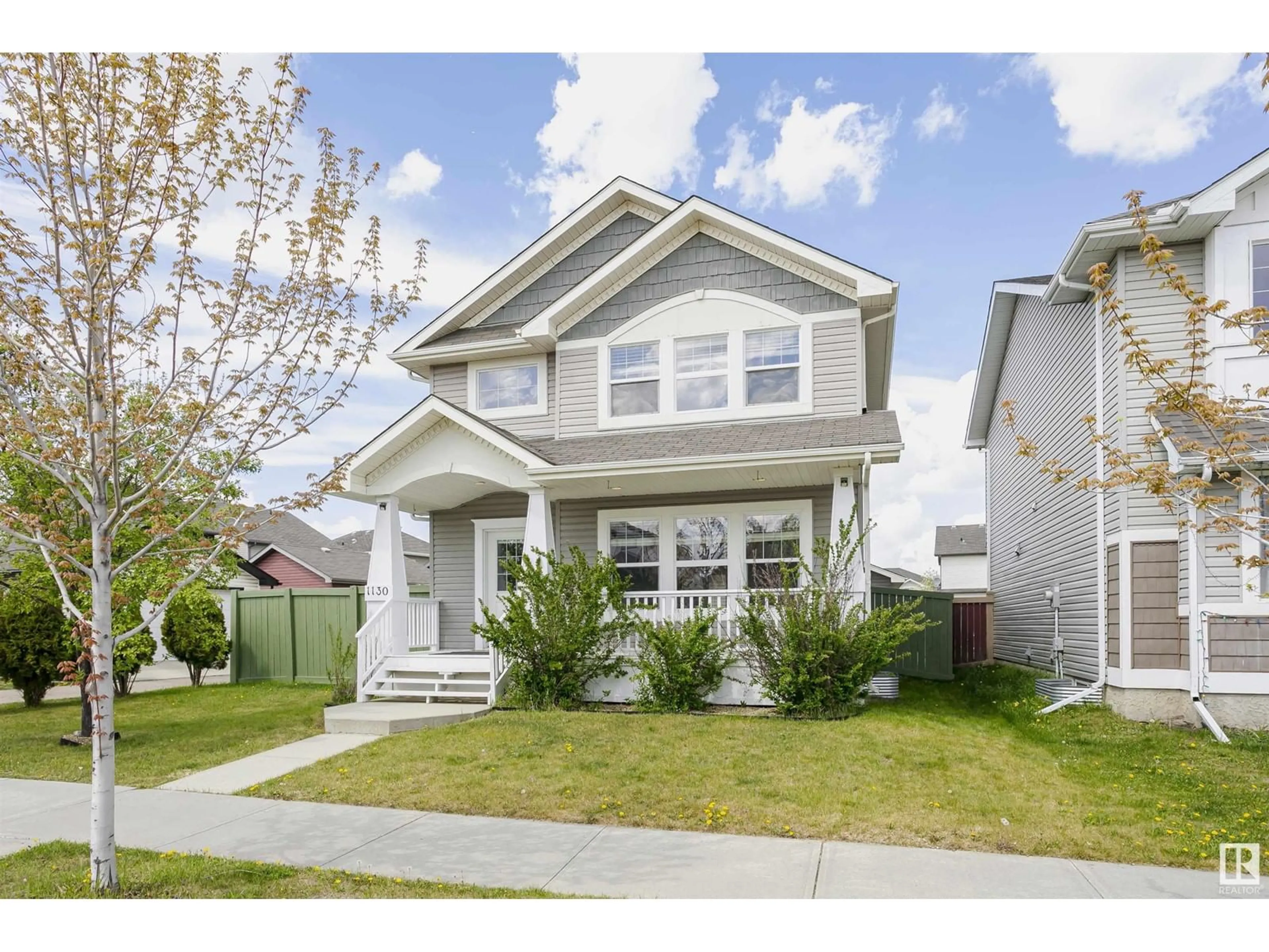 Home with vinyl exterior material, street for 1130 37A AV AV, Edmonton Alberta T6T0E7
