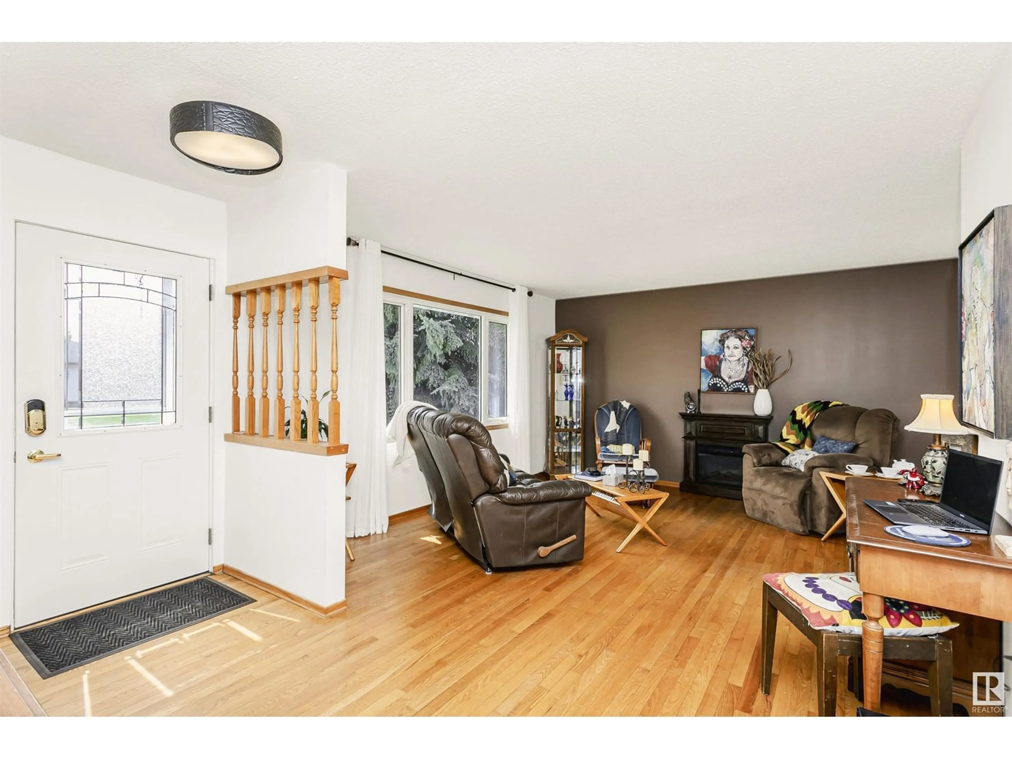 Living room with furniture, wood/laminate floor for 63 UMBACH RD, Stony Plain Alberta T7Z1G1