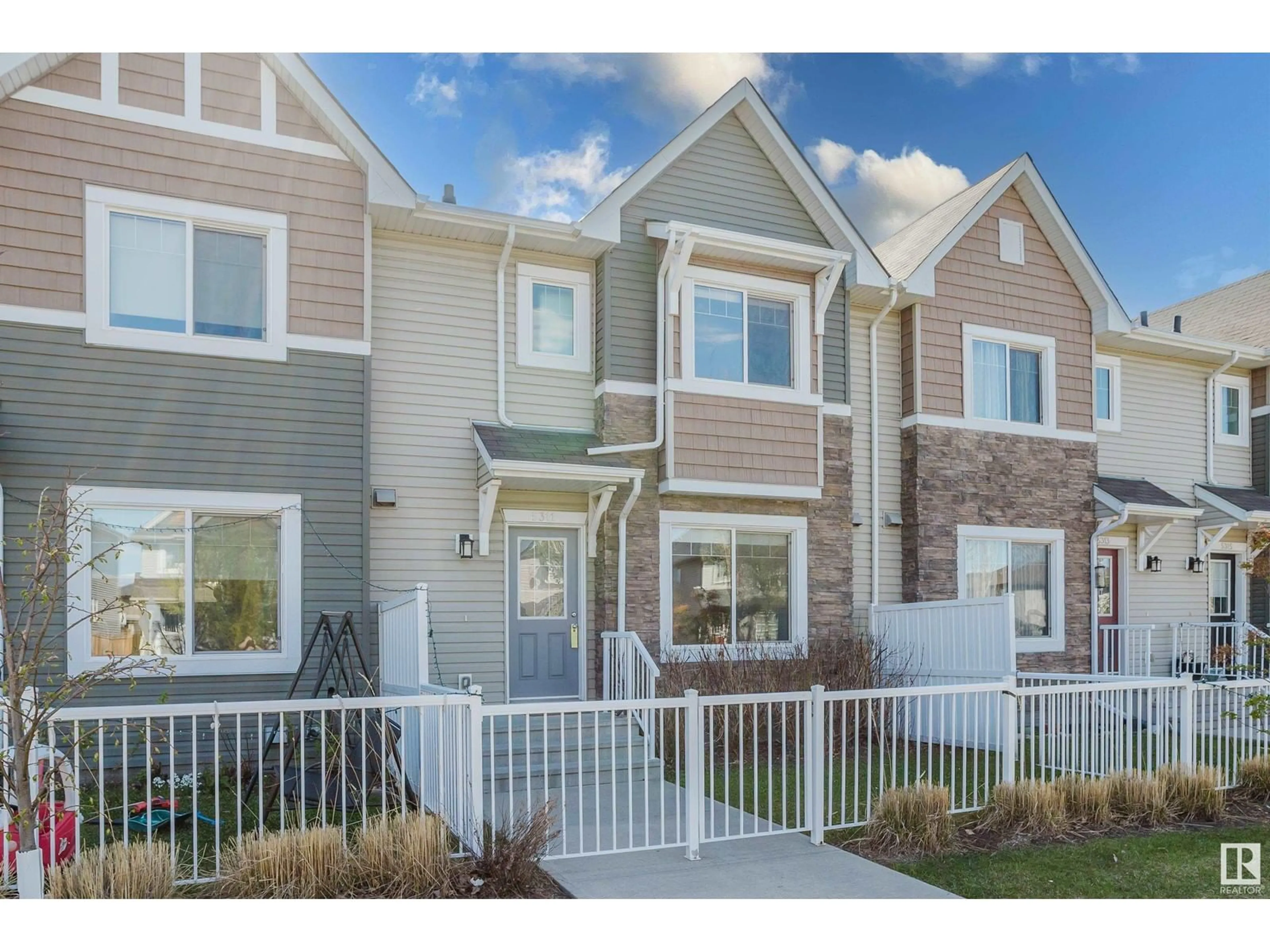 Home with vinyl exterior material, street for 5311 3 AV SW, Edmonton Alberta T6X0W7
