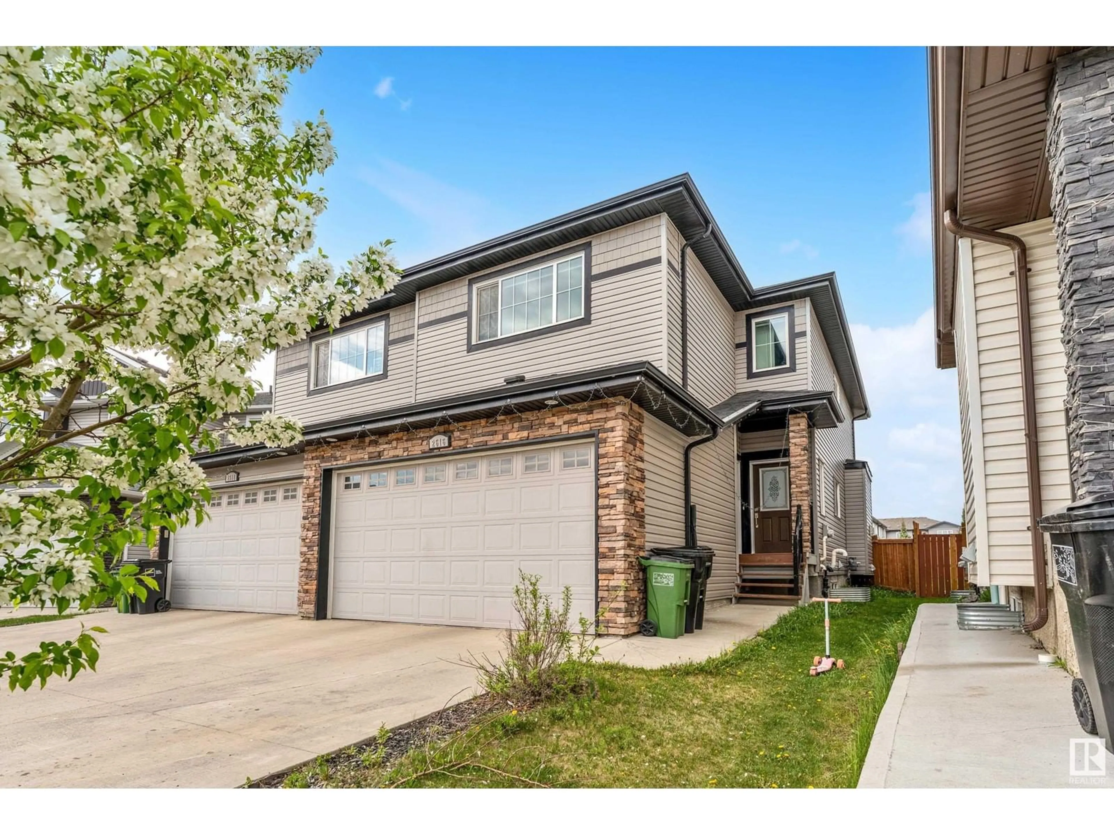 Home with vinyl exterior material, street for 2616 22 AV, Edmonton Alberta T6T0Y5