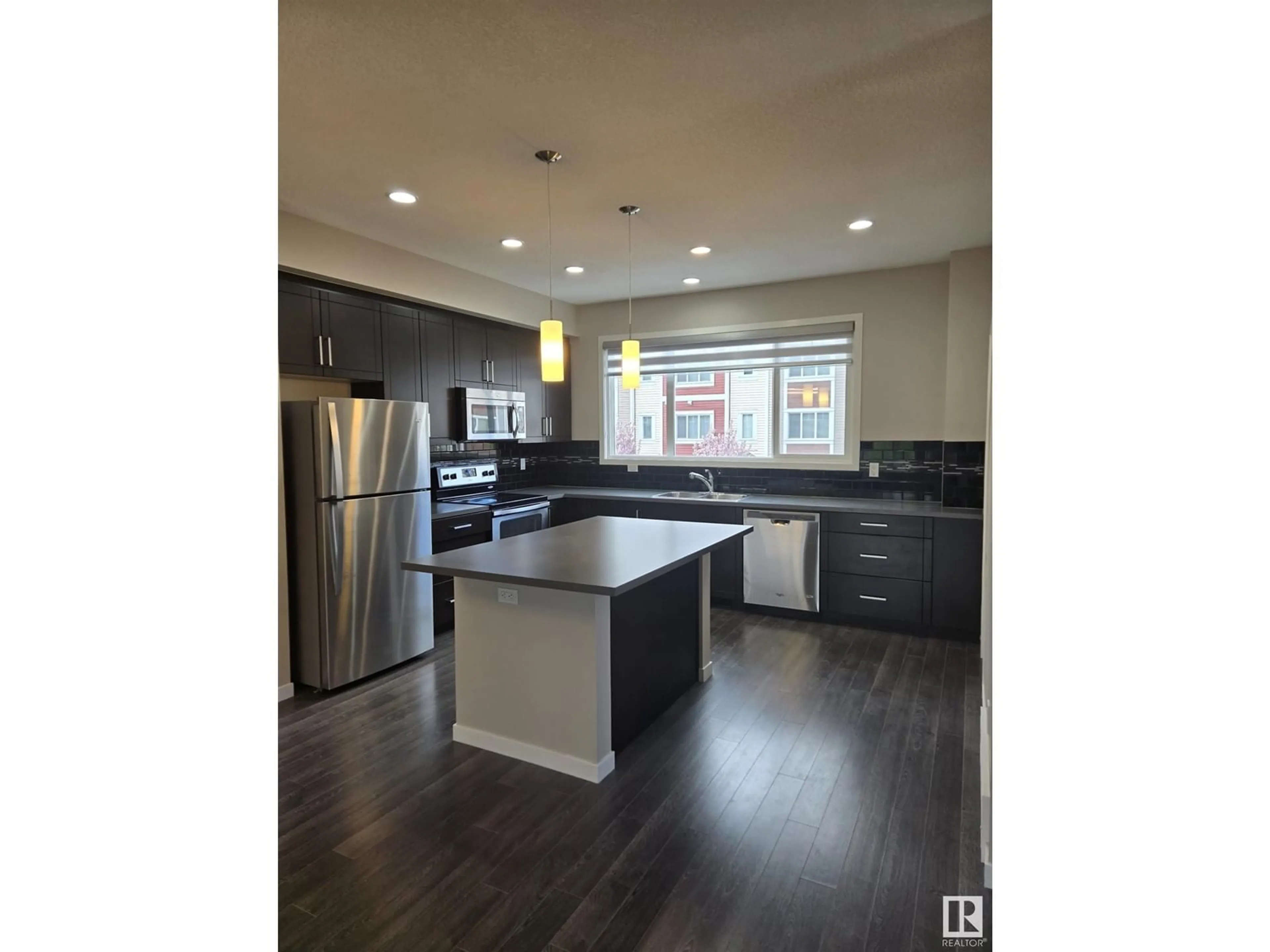 Open concept kitchen, wood/laminate floor for 320 SECORD BLVD NW, Edmonton Alberta T5T7E8