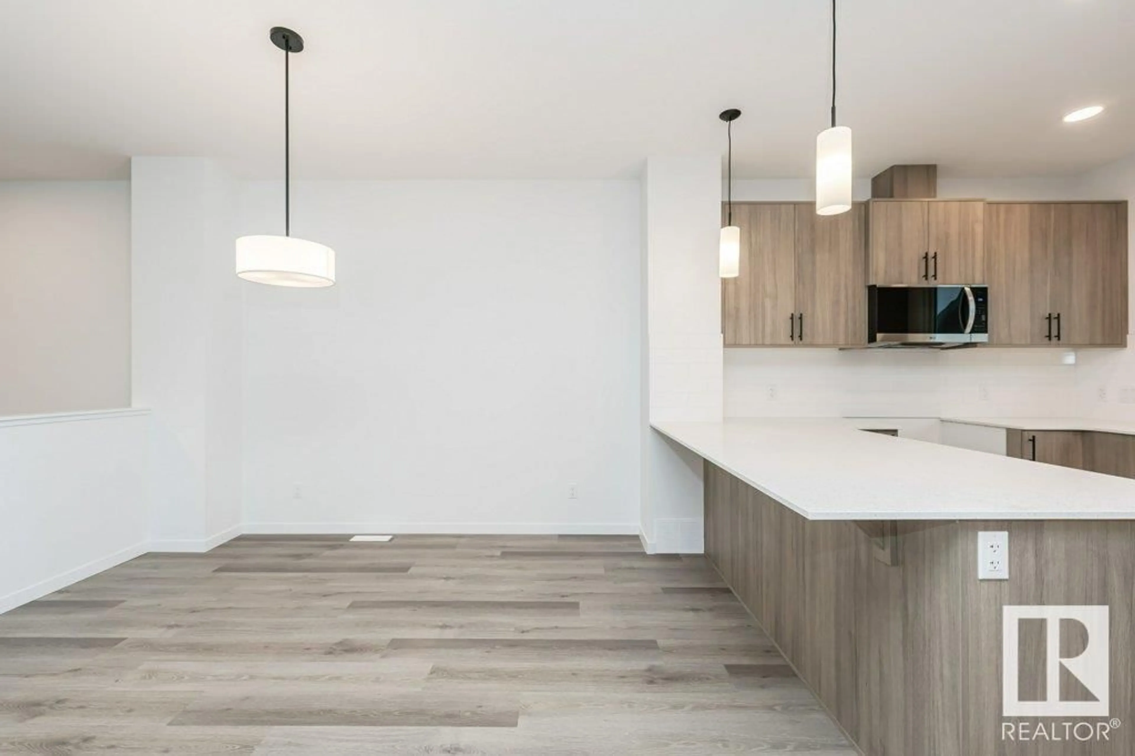 Open concept kitchen, wood/laminate floor for 6253 175A AV, Edmonton Alberta T5Y4A5