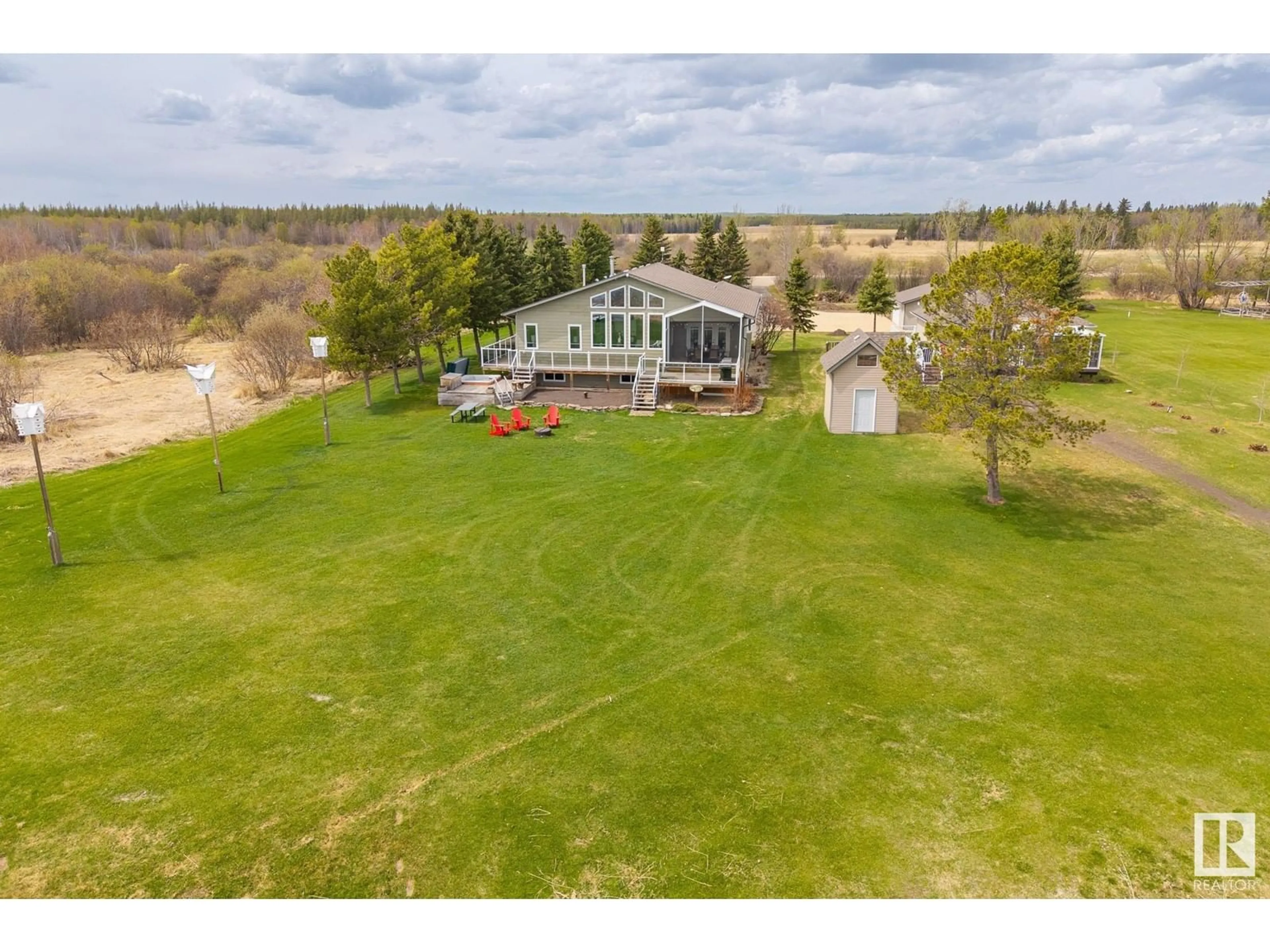 A pic from outside/outdoor area/front of a property/back of a property/a pic from drone, water/lake/river/ocean view for 47257 HWY 771, Rural Leduc County Alberta T0C2V0