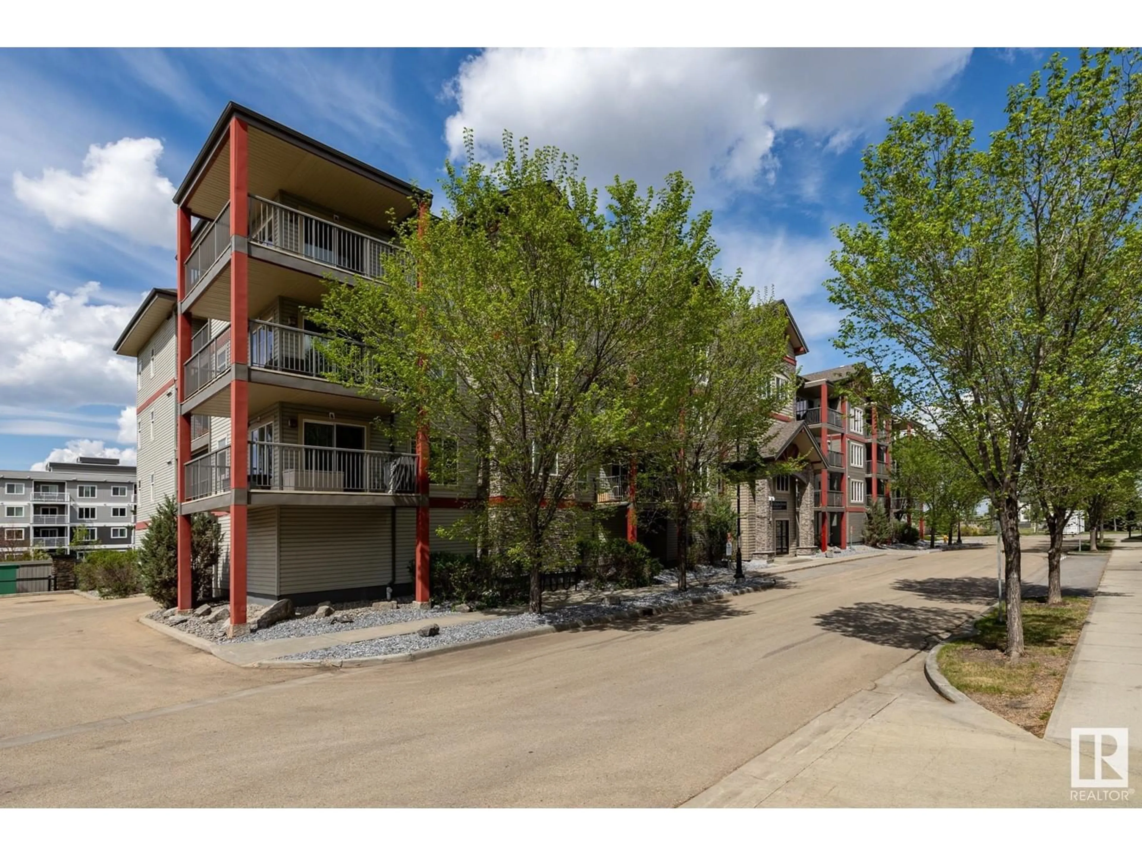A pic from outside/outdoor area/front of a property/back of a property/a pic from drone, street for #203 - 1619 JAMES MOWATT TR, Edmonton Alberta T6W0J7