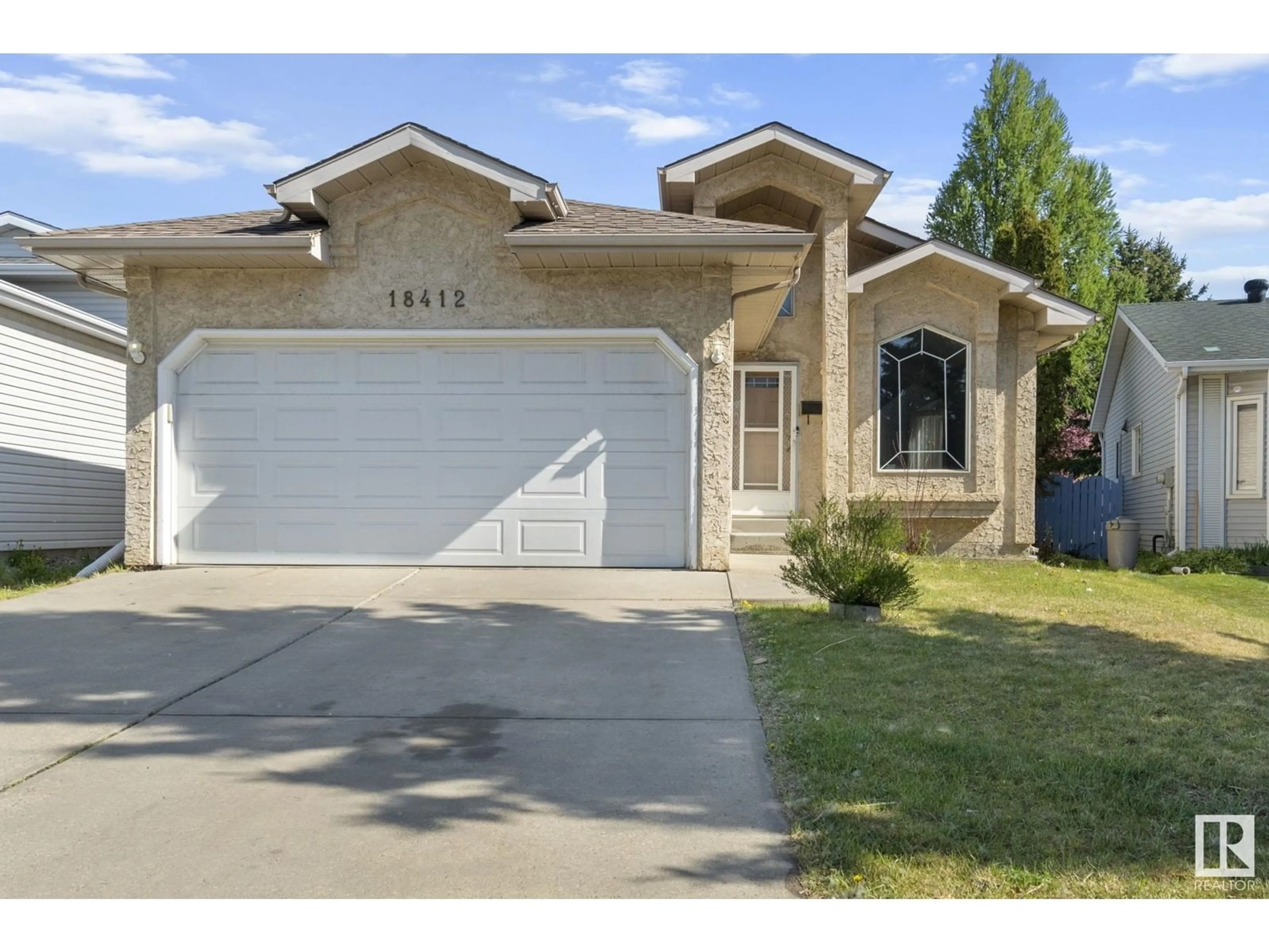 Home with vinyl exterior material, street for 18412 77 AV, Edmonton Alberta T5T5X3