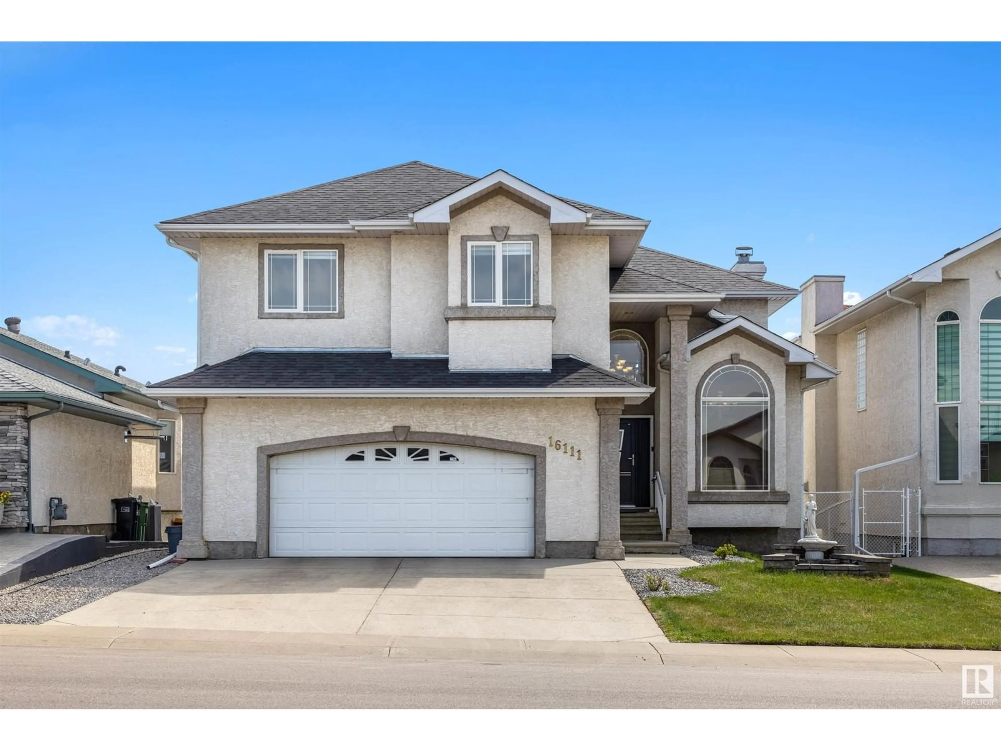 Home with vinyl exterior material, street for 16111 76 ST, Edmonton Alberta T5Z3N6