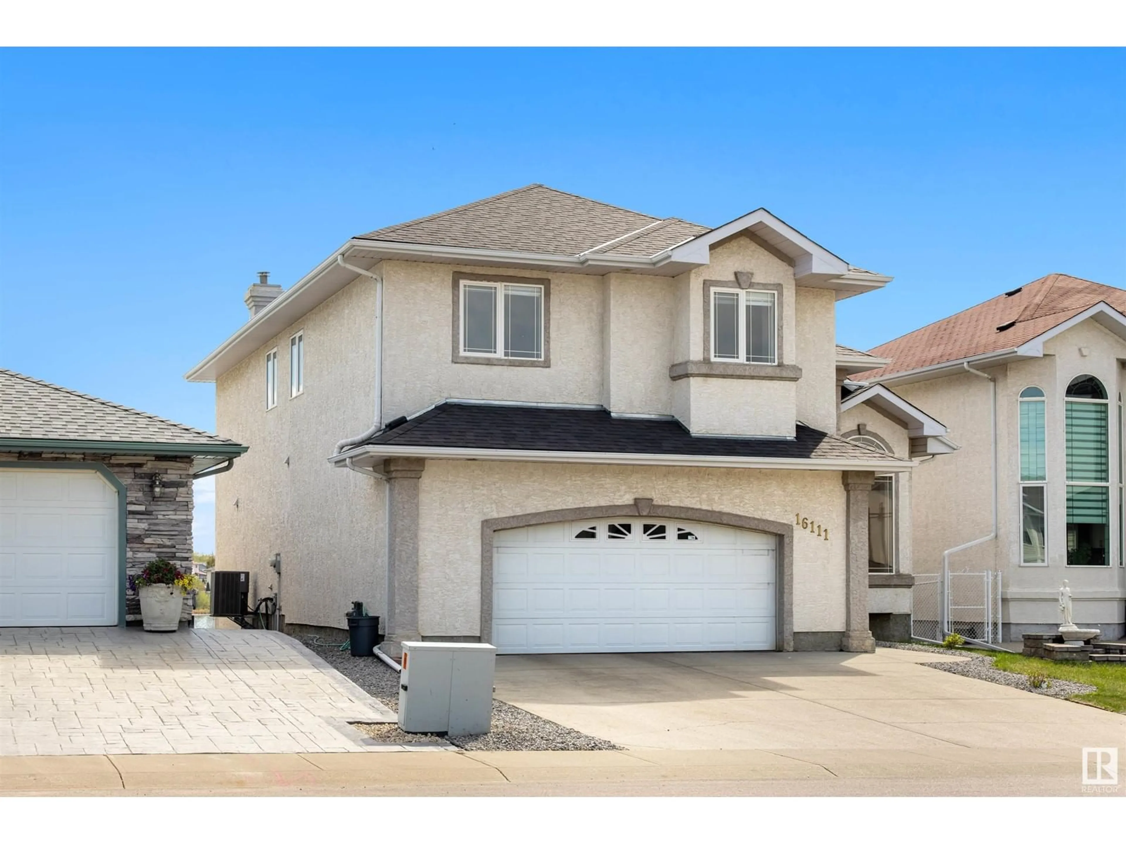 Home with vinyl exterior material, street for 16111 76 ST, Edmonton Alberta T5Z3N6