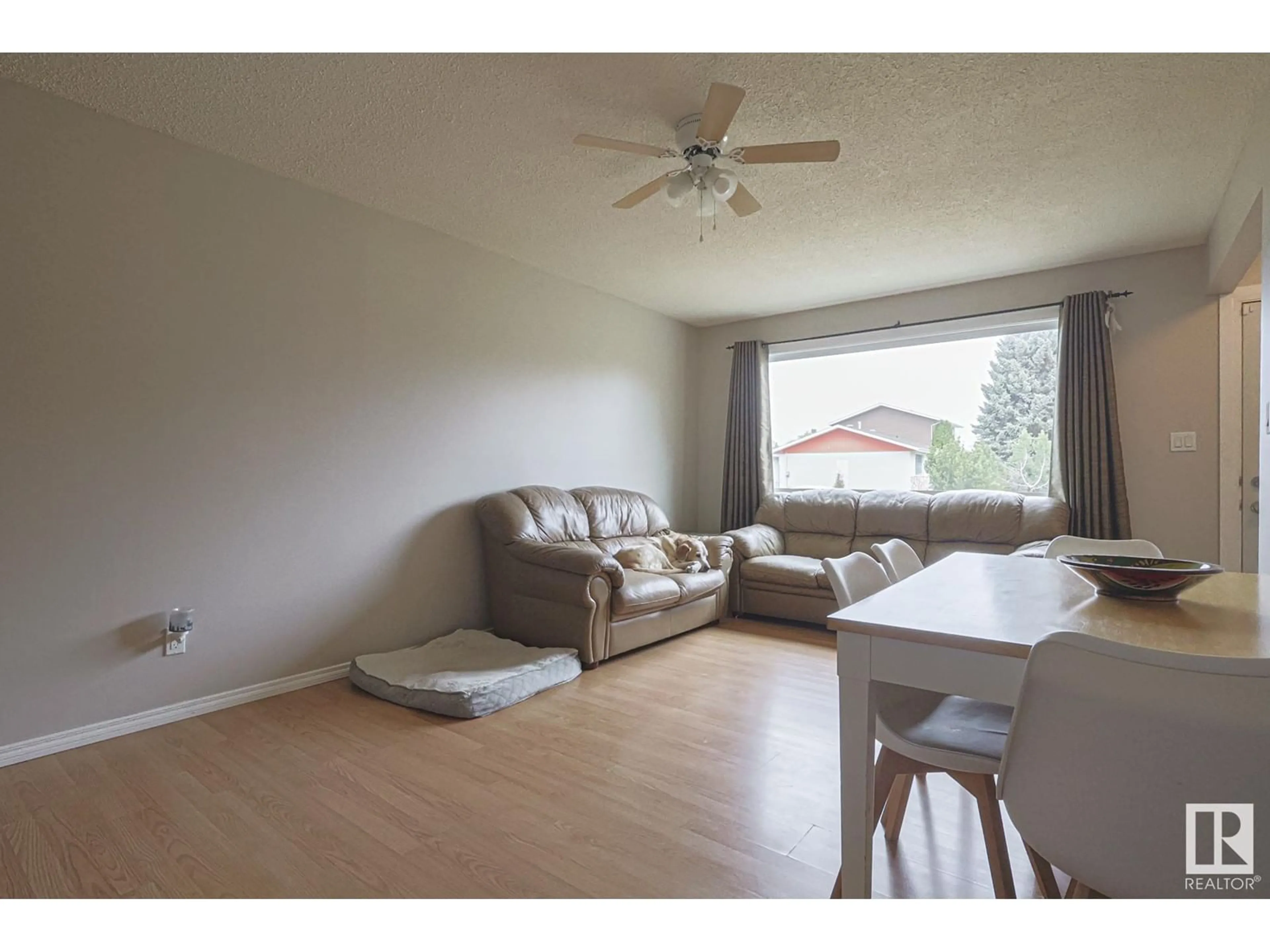 Living room with furniture, wood/laminate floor for 4200 42 AV, Stony Plain Alberta T7Z1J8