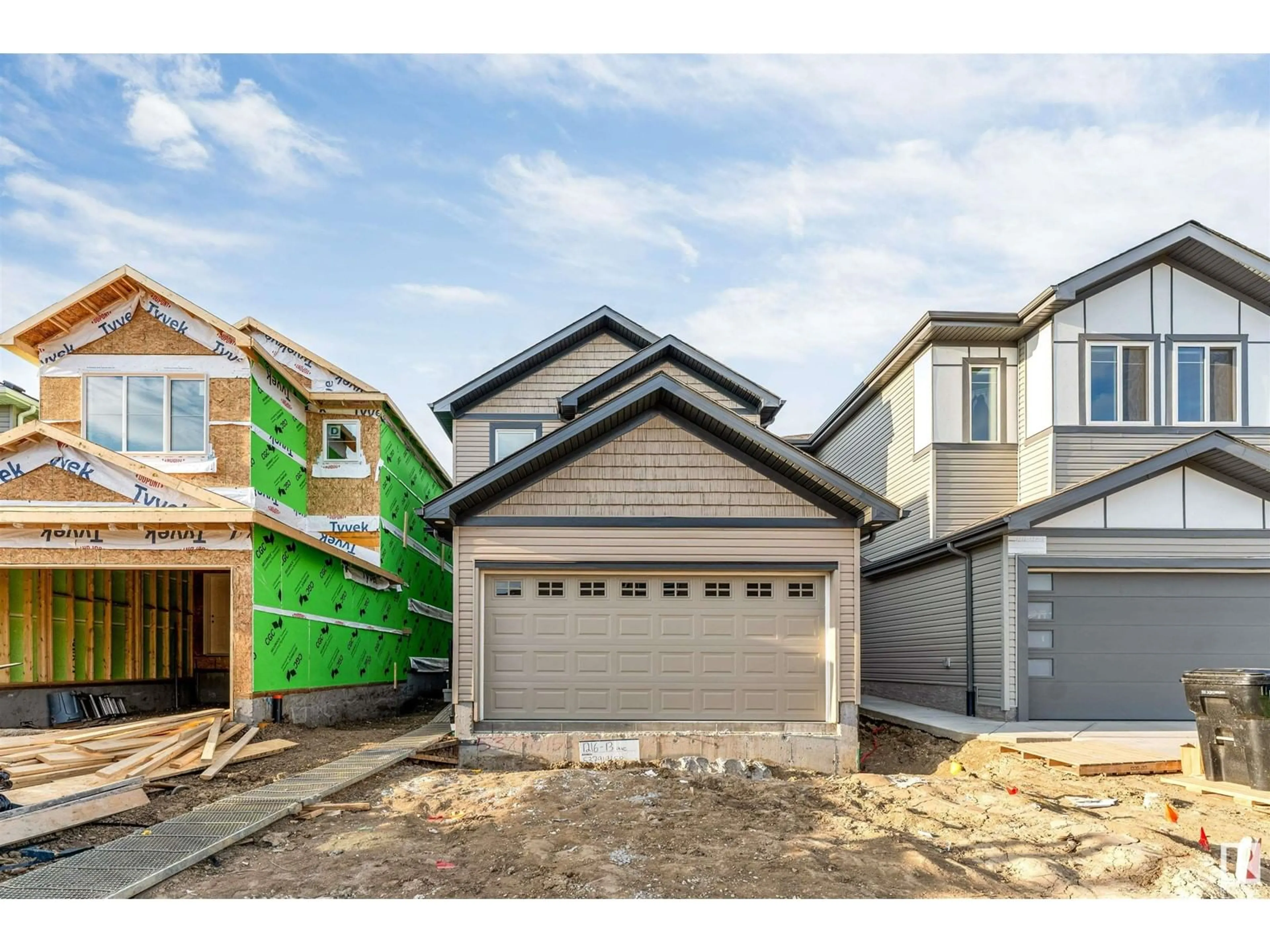Home with vinyl exterior material, street for 1216 13 AVE NW, Edmonton Alberta T6T2W2