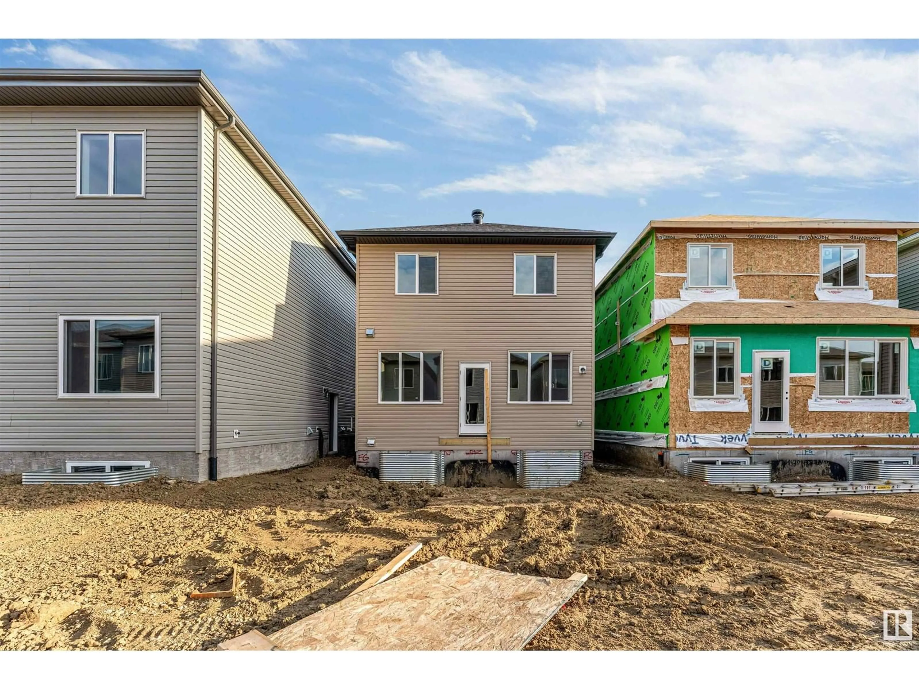 Home with vinyl exterior material, street for 1216 13 AVE NW, Edmonton Alberta T6T2W2