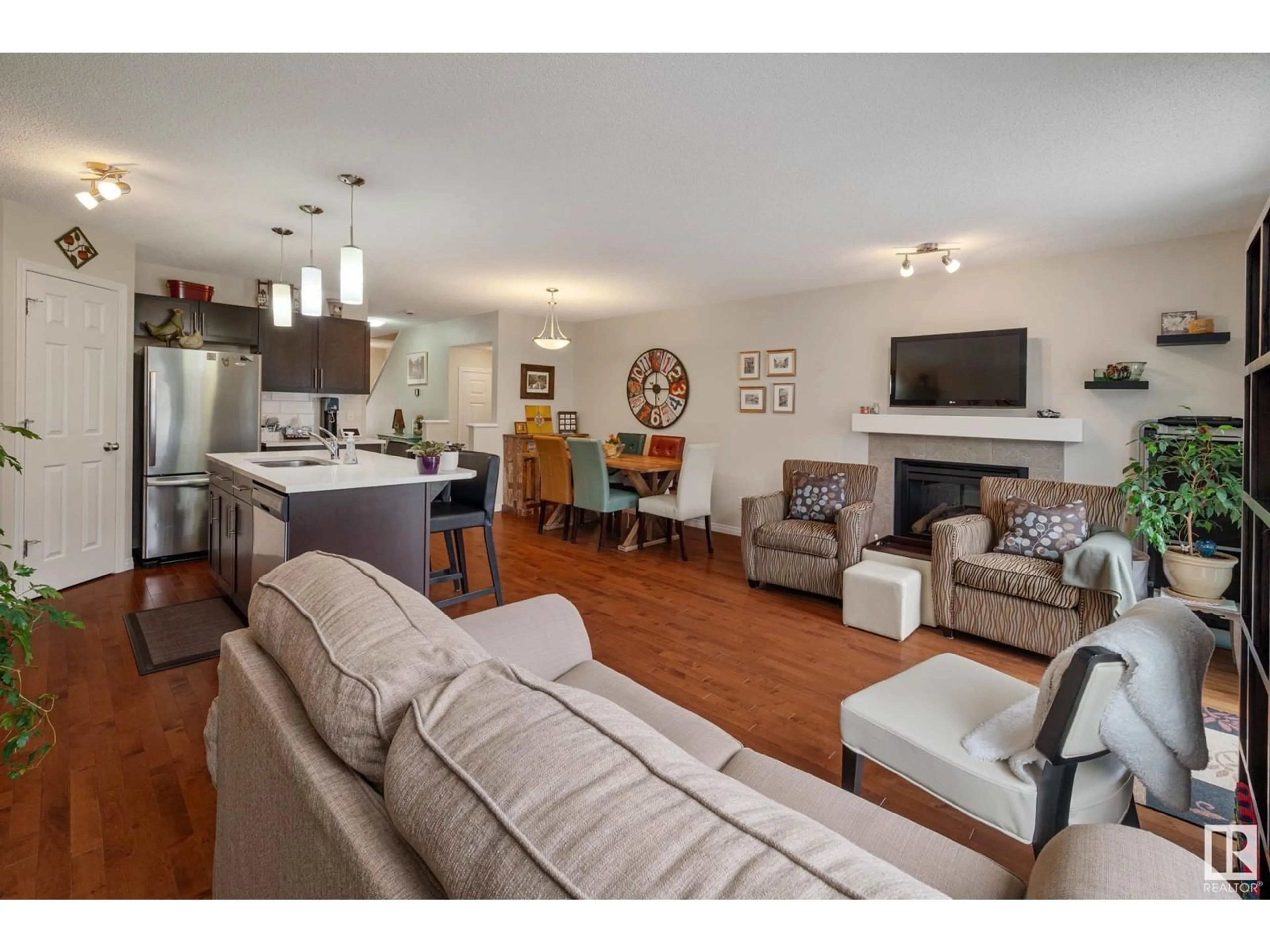 Living room with furniture, wood/laminate floor for 1923 CHAPMAN RD, Edmonton Alberta T6W0Y7