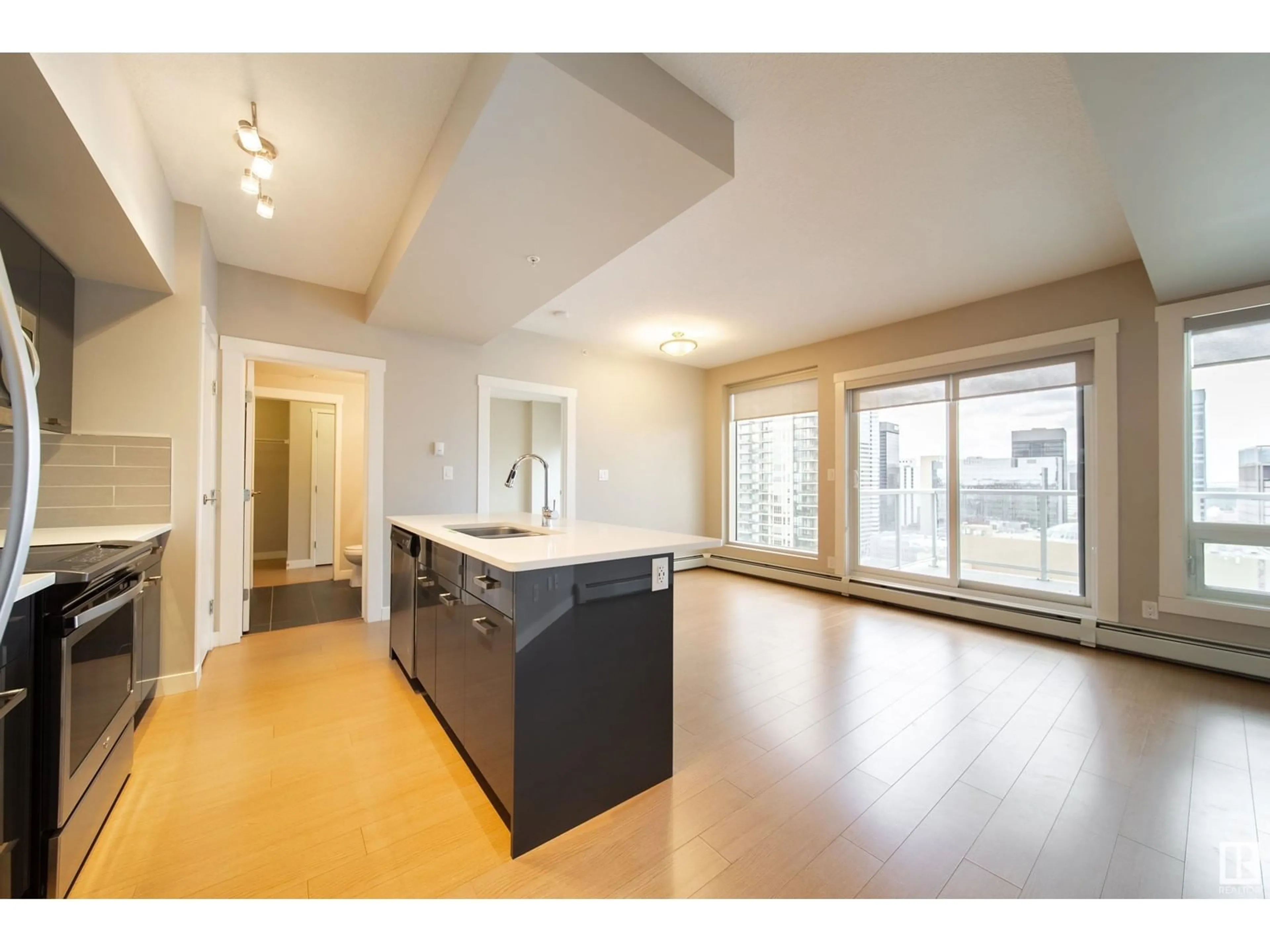 Open concept kitchen, wood/laminate floor for 1901 - 10410 102 AV, Edmonton Alberta T5J0E9