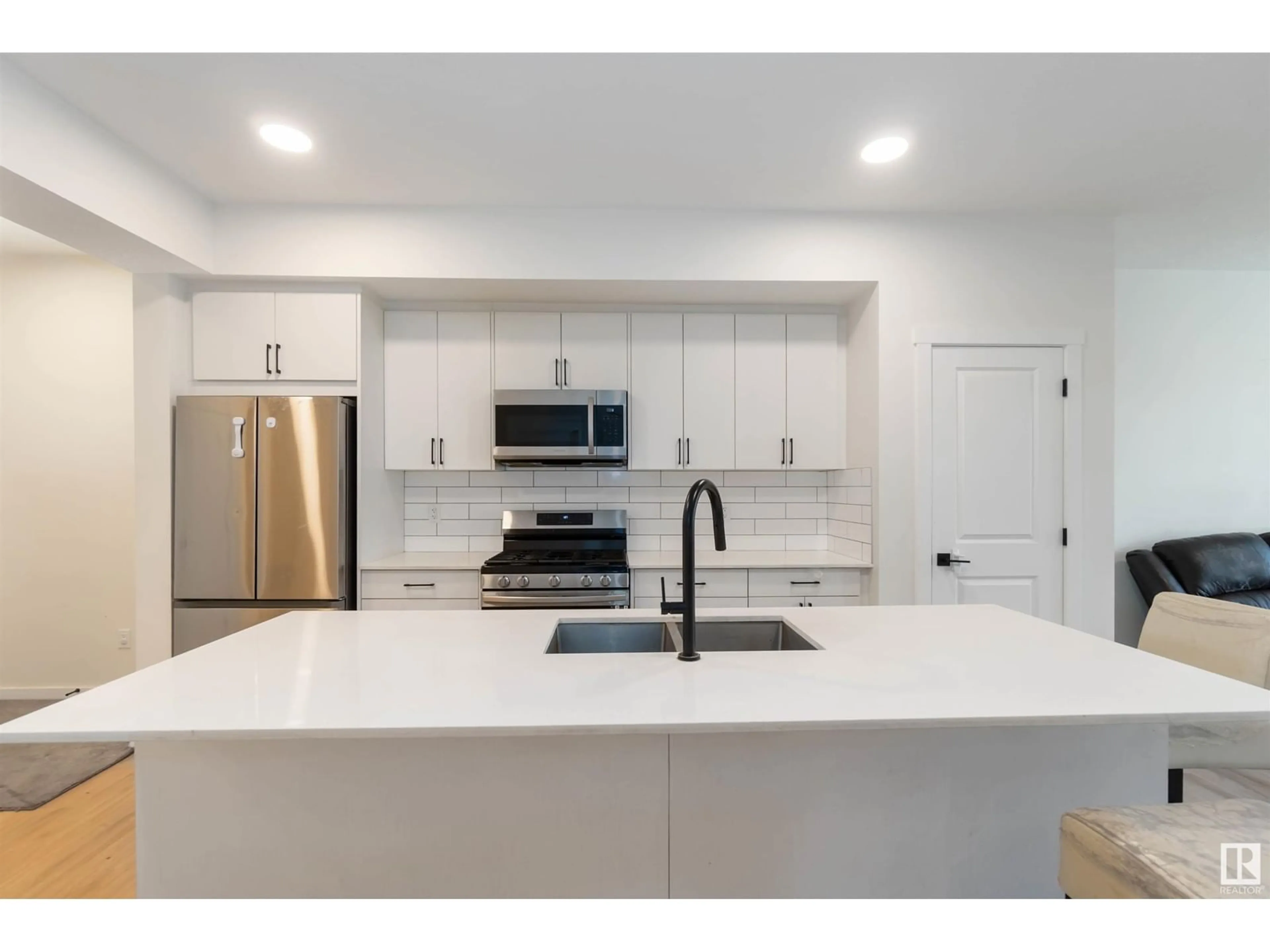 Open concept kitchen, ceramic/tile floor for 2172 52 ST, Edmonton Alberta T6X1Z7