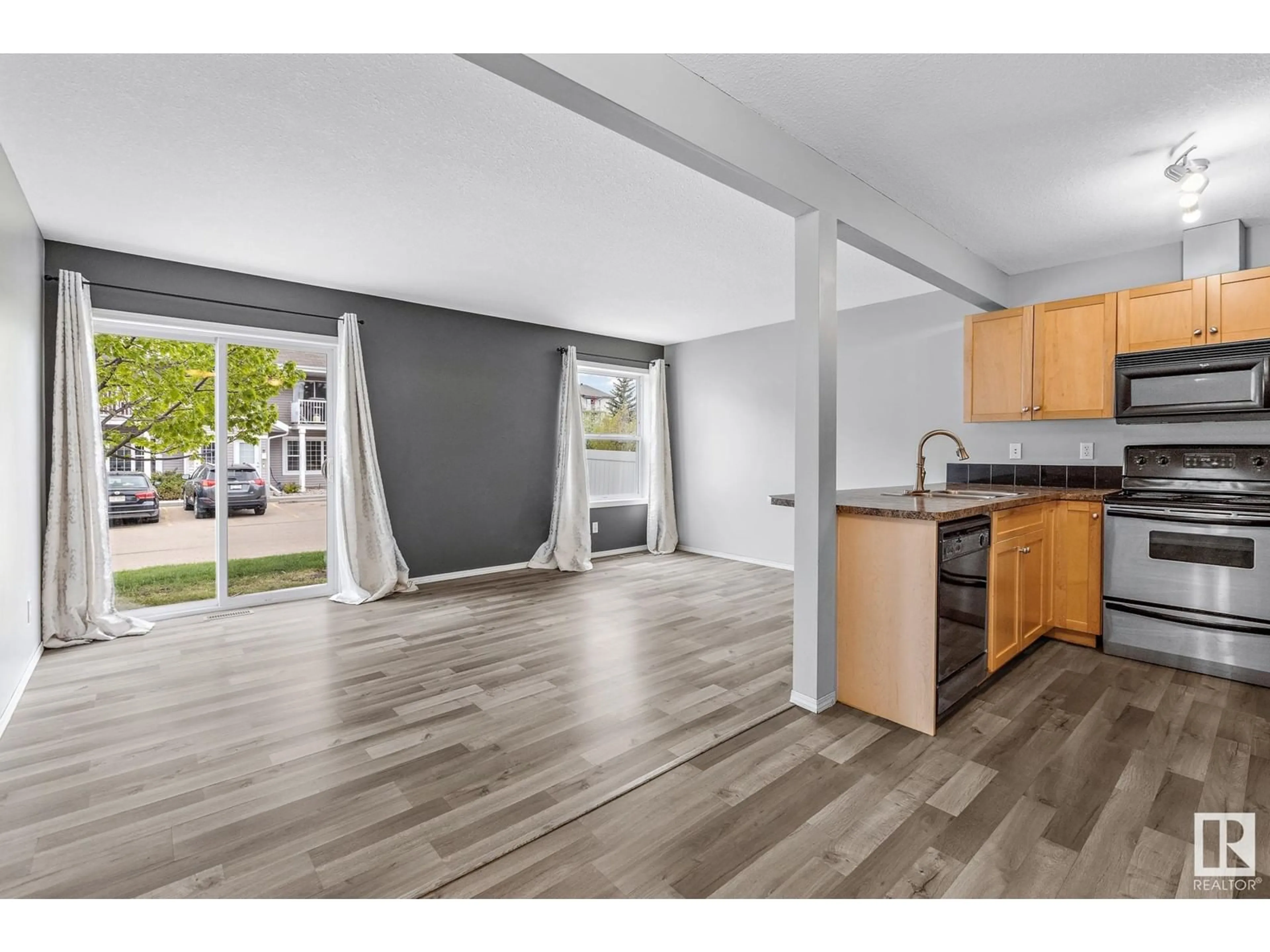 Open concept kitchen, wood/laminate floor for 150 - 39 EDWARDS DR, Edmonton Alberta T6X1M4