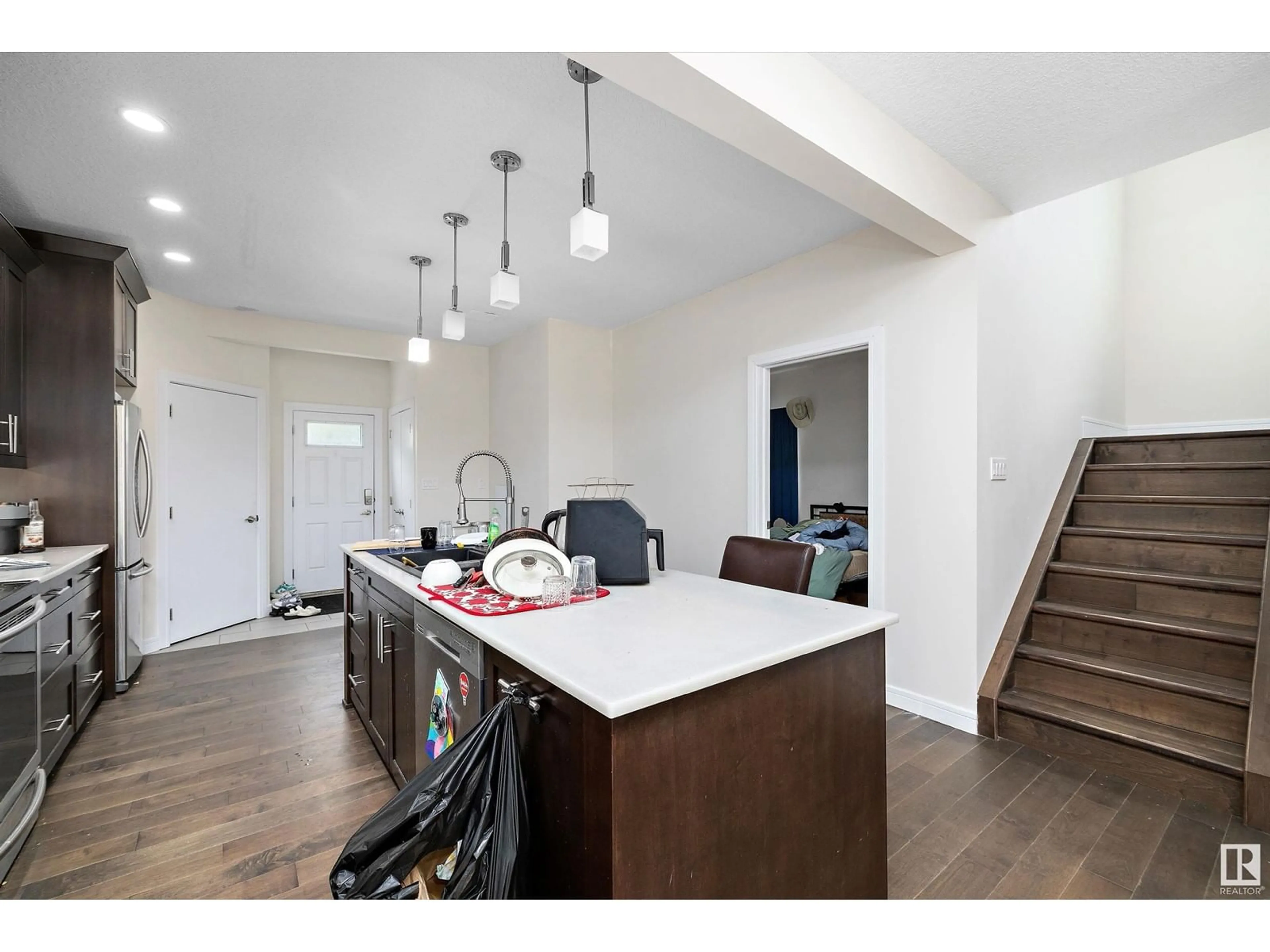 Open concept kitchen, wood/laminate floor for 10717 76 AV, Edmonton Alberta T6E1L8