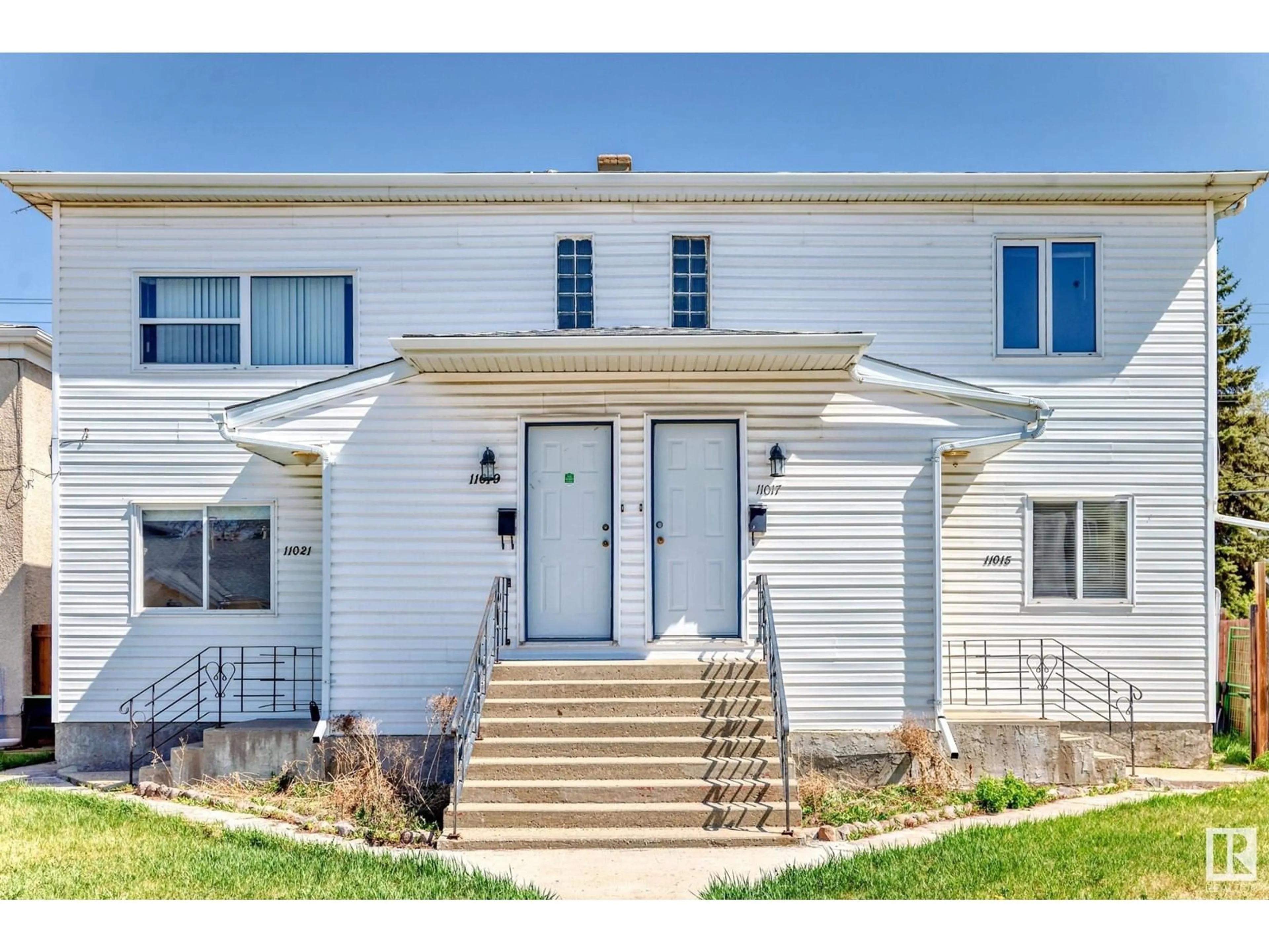 Home with vinyl exterior material, street for 11015 96 ST, Edmonton Alberta T5H2K7