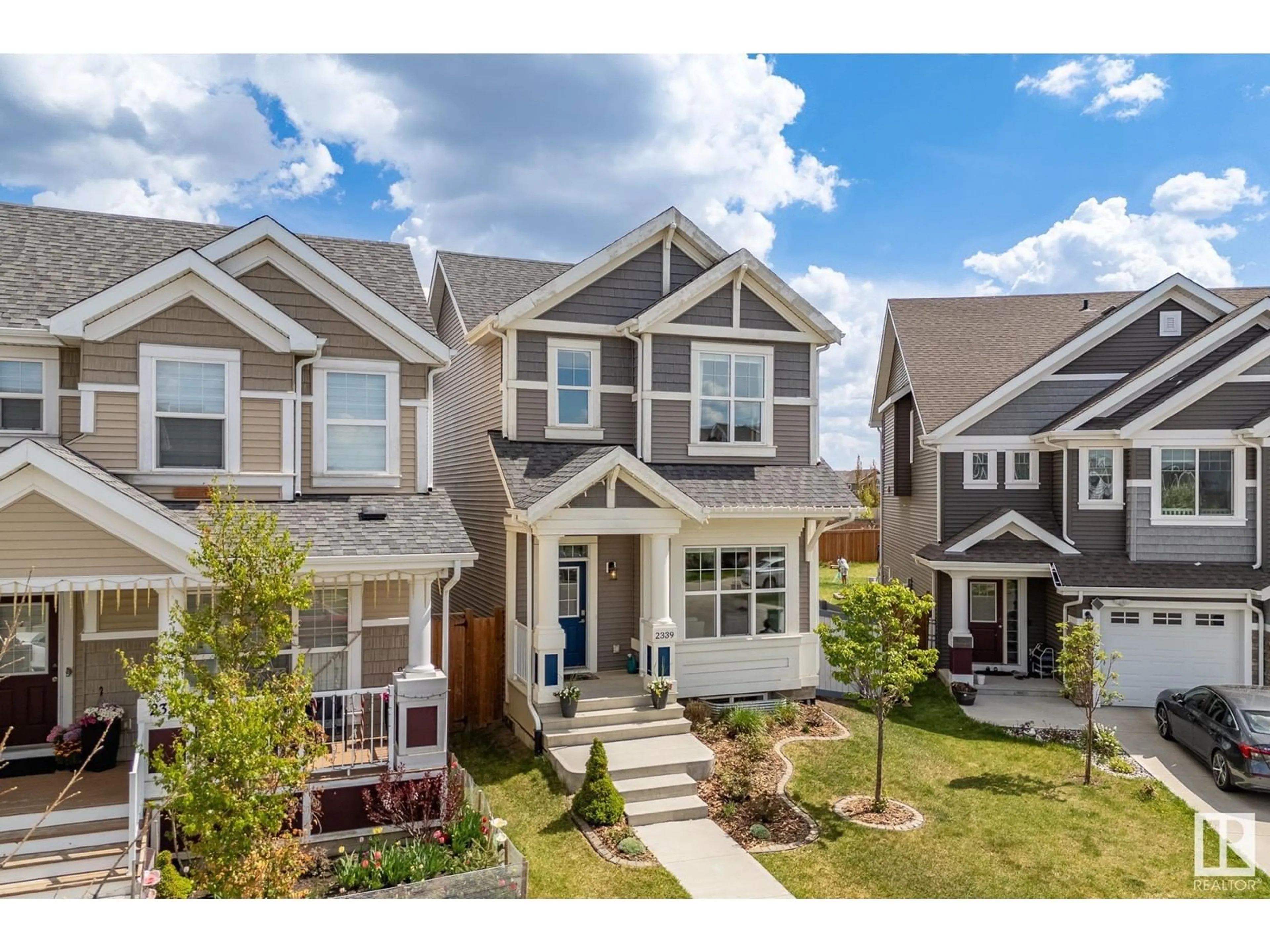 Home with vinyl exterior material, street for 2339 84 ST, Edmonton Alberta T6X2G1