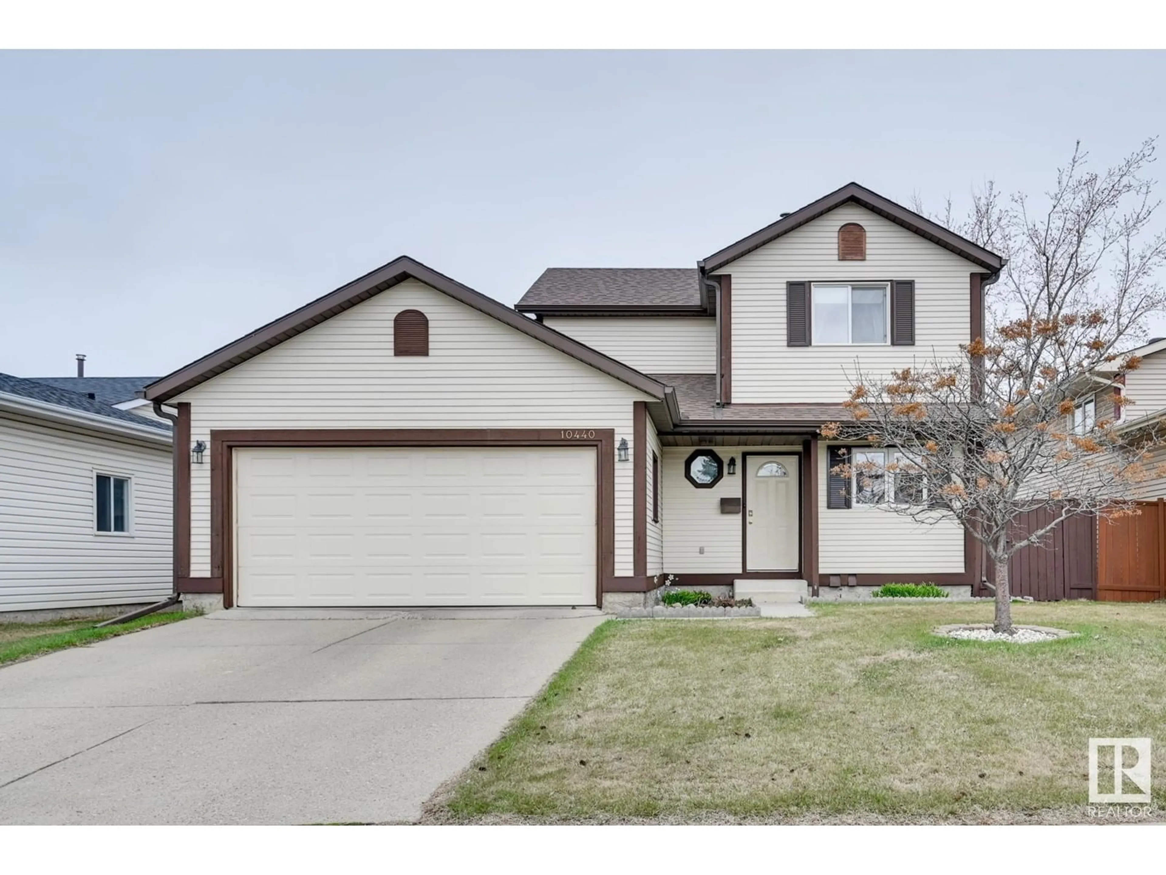 Home with vinyl exterior material, street for 10440 16 AVENUE AVENUE, Edmonton Alberta T6J5N8