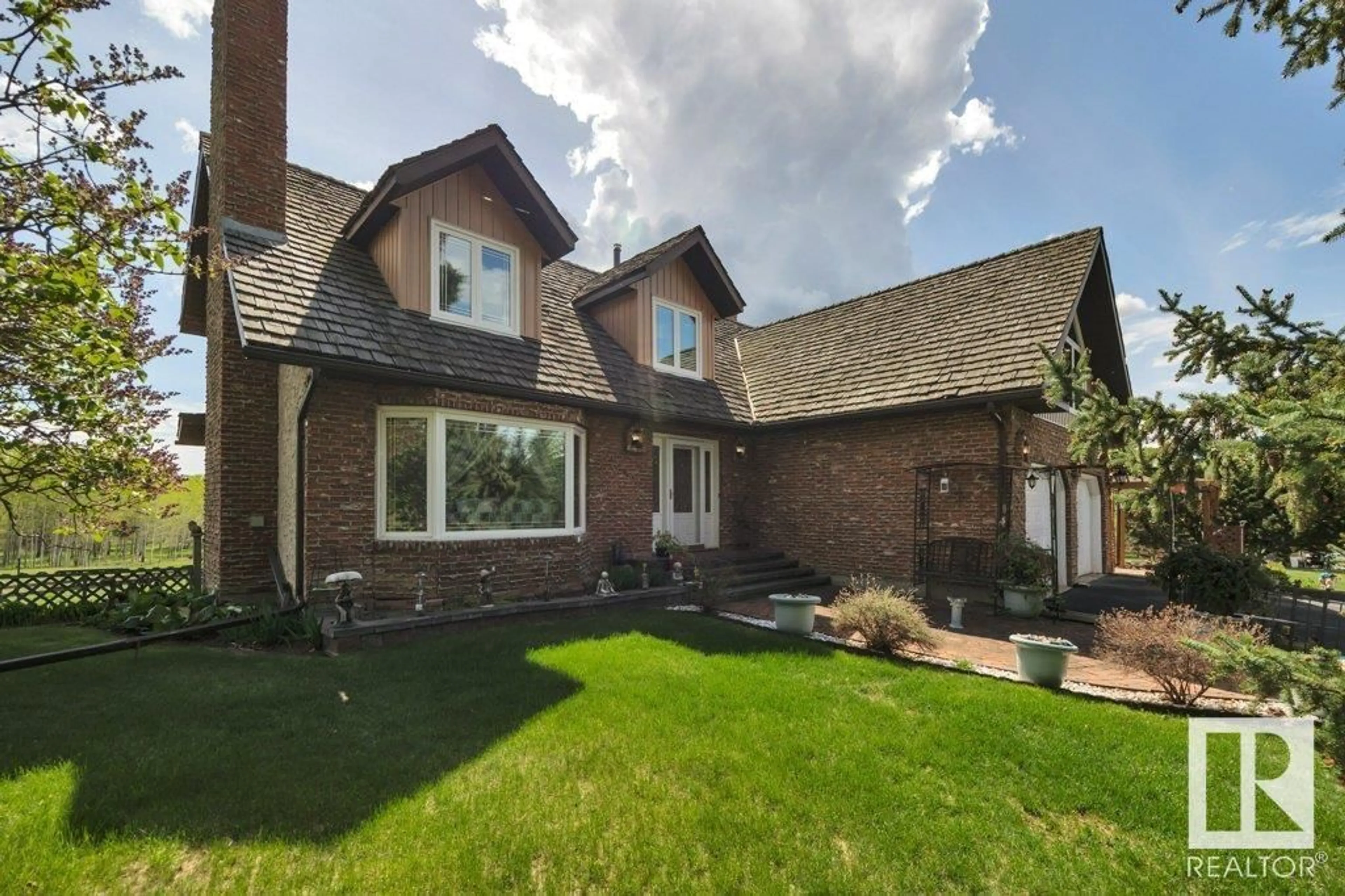 Home with brick exterior material, street for 20239 TWP ROAD 515, Rural Strathcona County Alberta T8G1G2
