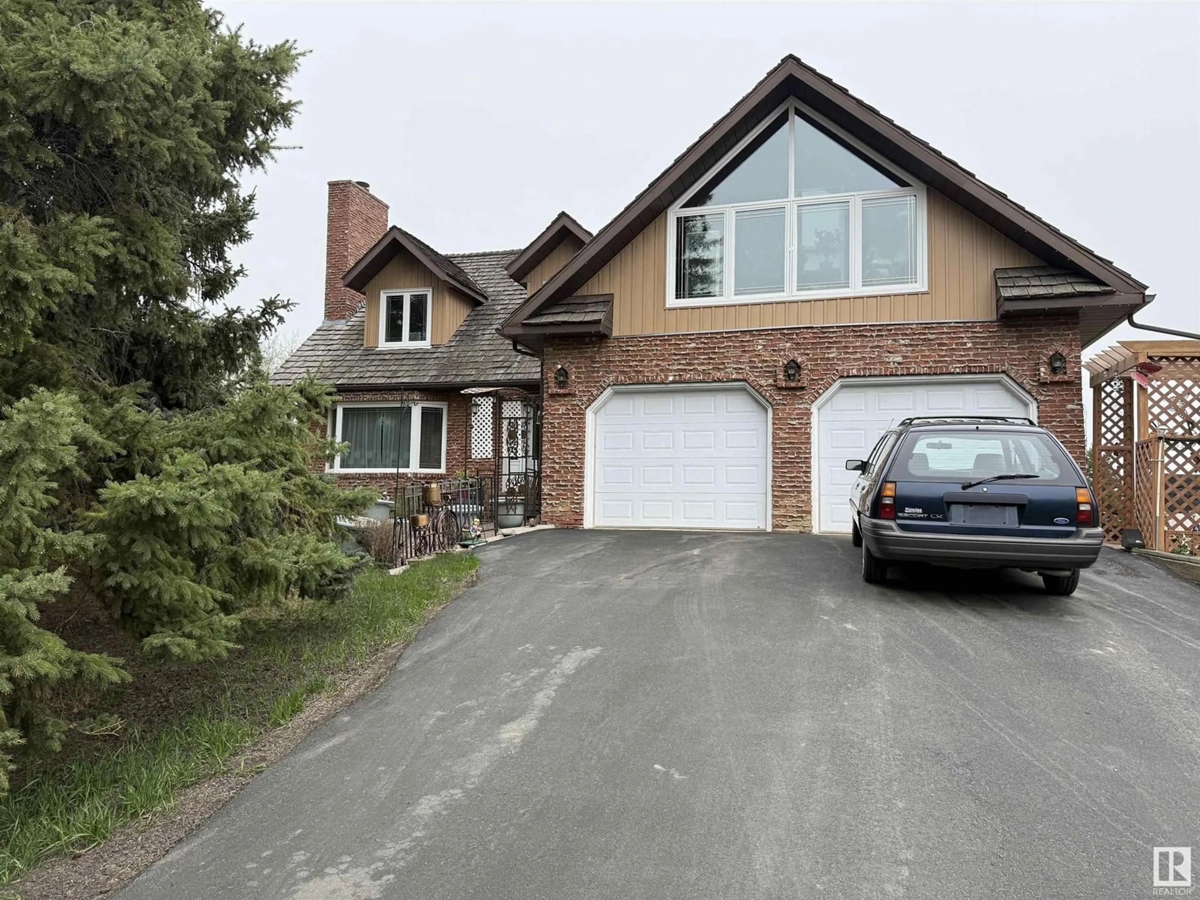 Home with brick exterior material, street for 20239 TWP ROAD 515, Rural Strathcona County Alberta T8G1G2