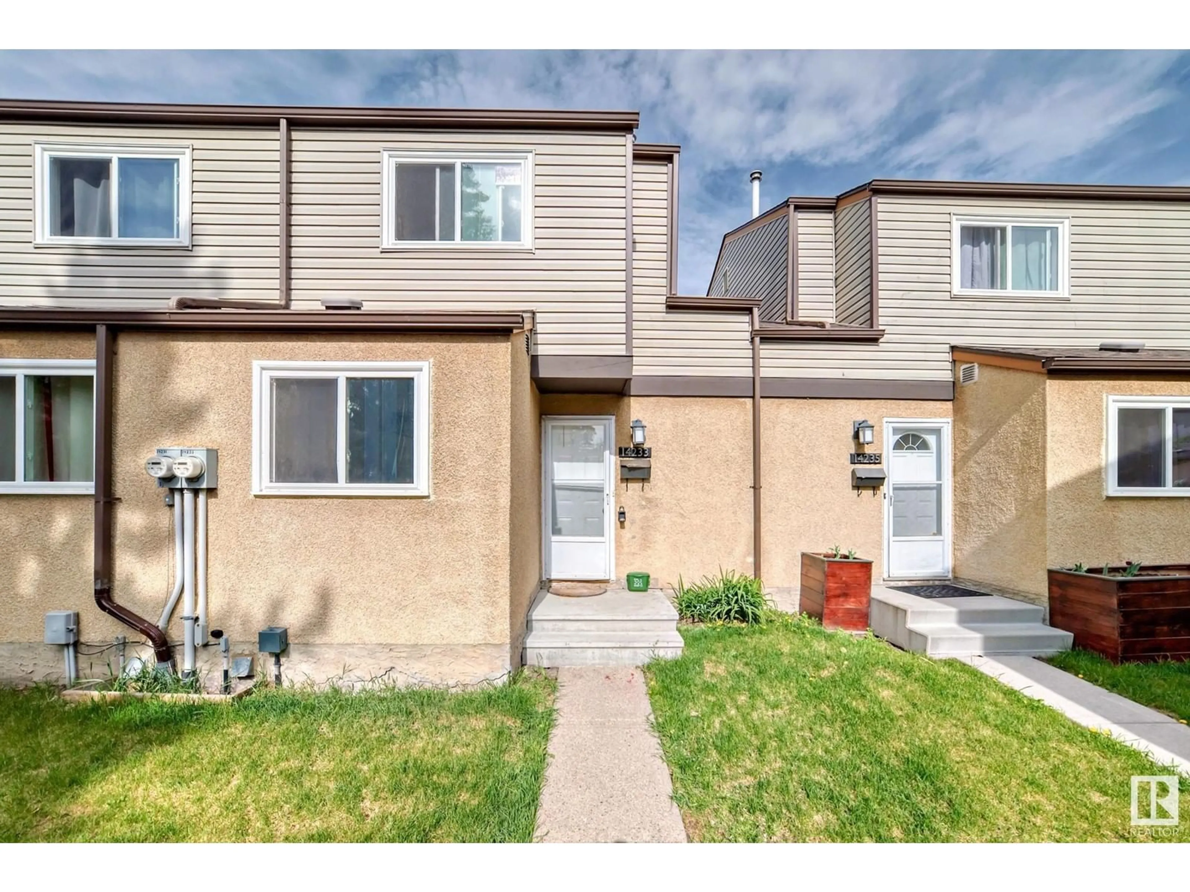 Home with vinyl exterior material, street for 14233 23 ST, Edmonton Alberta T5Y1E8