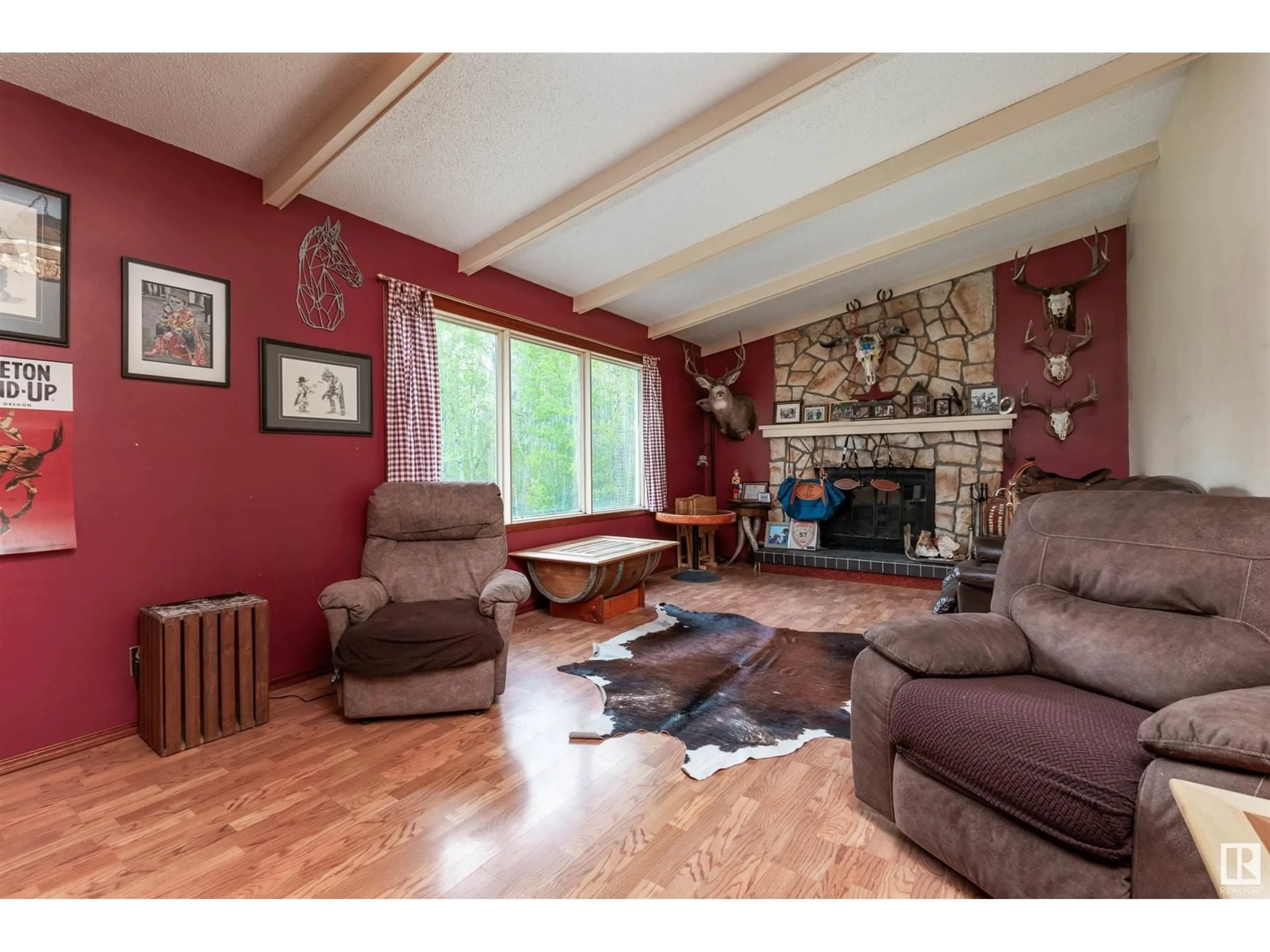 Living room with furniture, wood/laminate floor for 51331 - 97 RGE ROAD 224, Rural Strathcona County Alberta T8C1H3