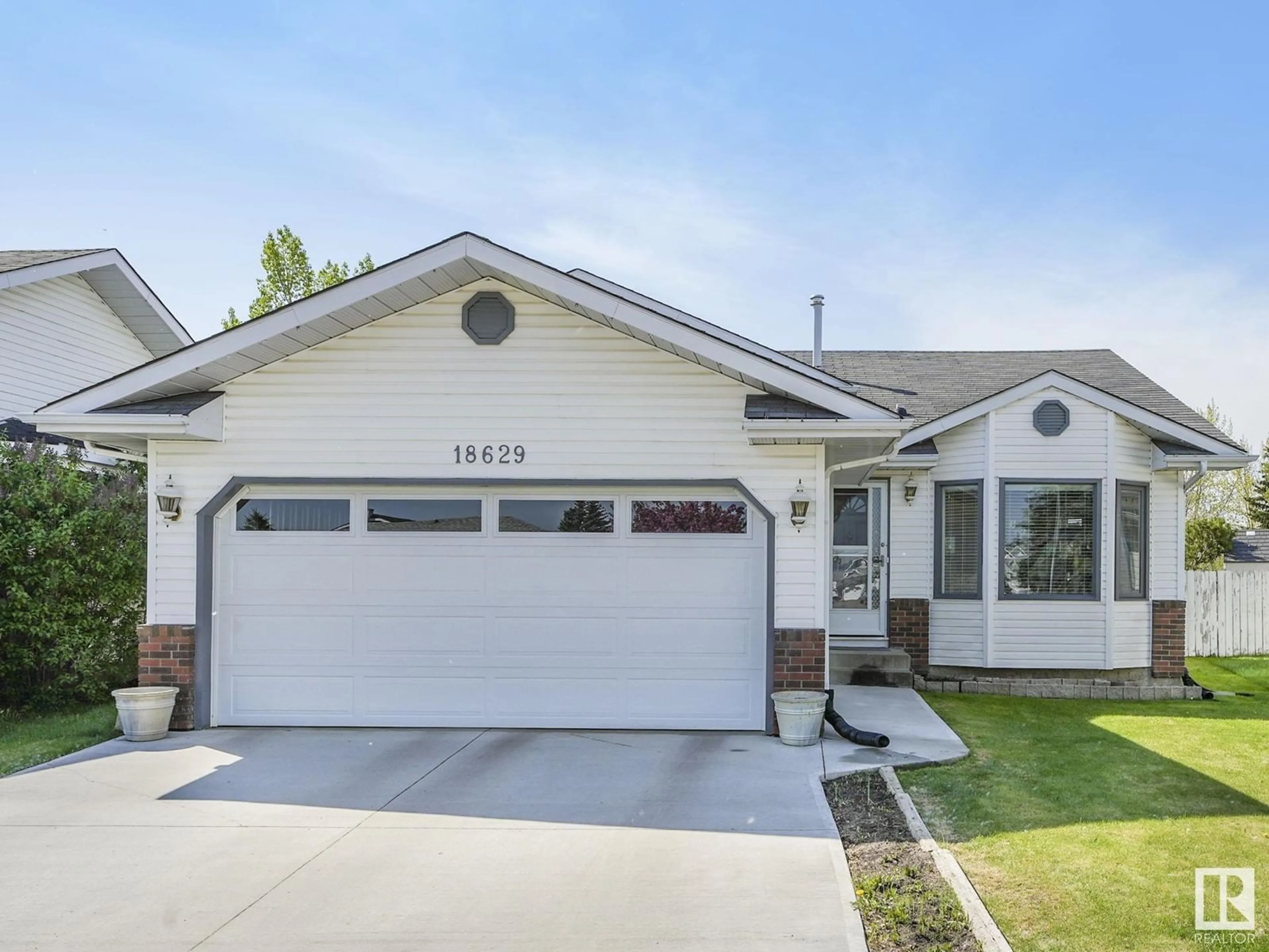 Home with vinyl exterior material, street for 18629 74 AV, Edmonton Alberta T5T5W4